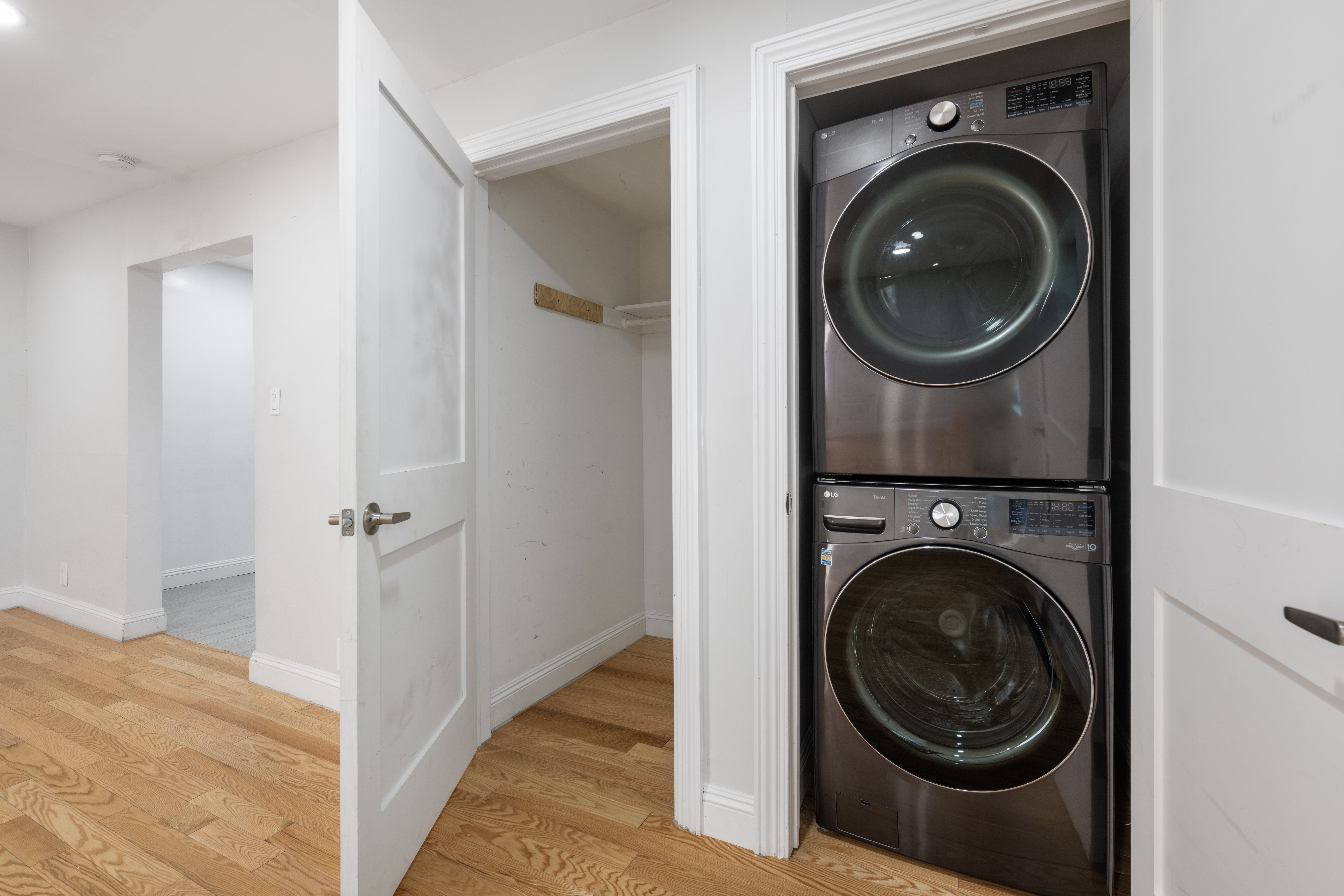 156 Summit Place, Unit 2 Bronx, NY 10463 - Photo 4 of 10 a view of a hallway with washer and dryer