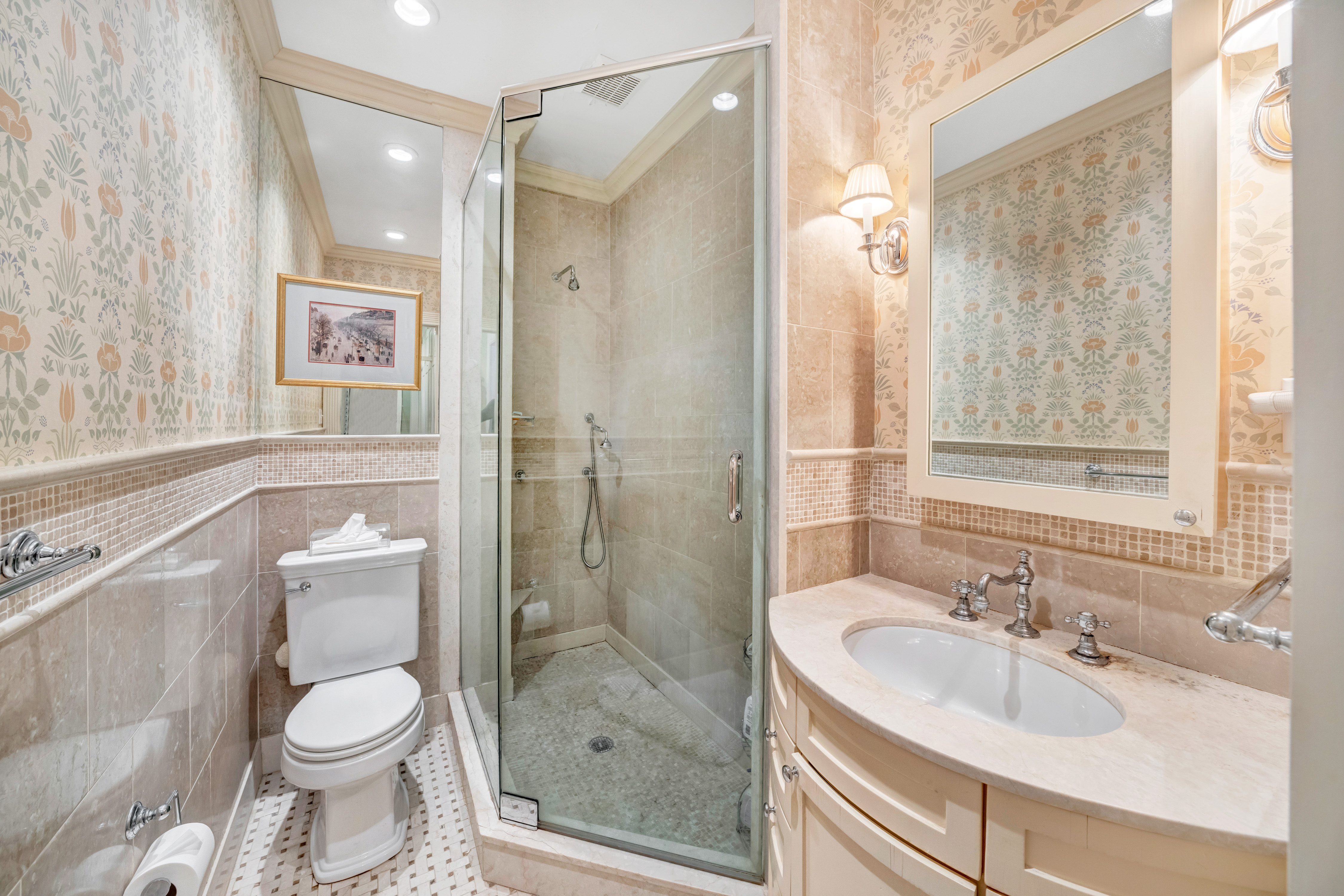 1060 Park Avenue, Unit 13G Manhattan, NY 10128 - Photo 7 of 11 a bathroom with a sink toilet and shower
