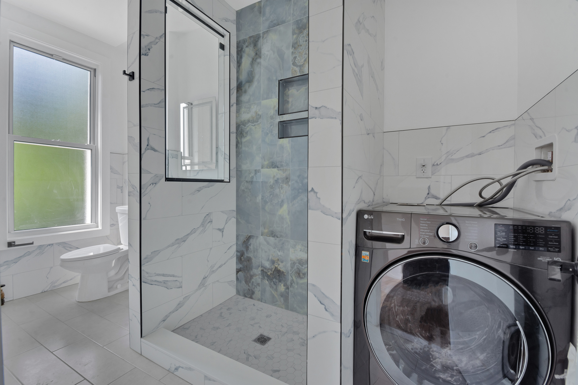 1275 Jefferson Avenue, Unit 2 Brooklyn, NY 11221 - Photo 9 of 11 a bathroom with a sink a toilet and shower