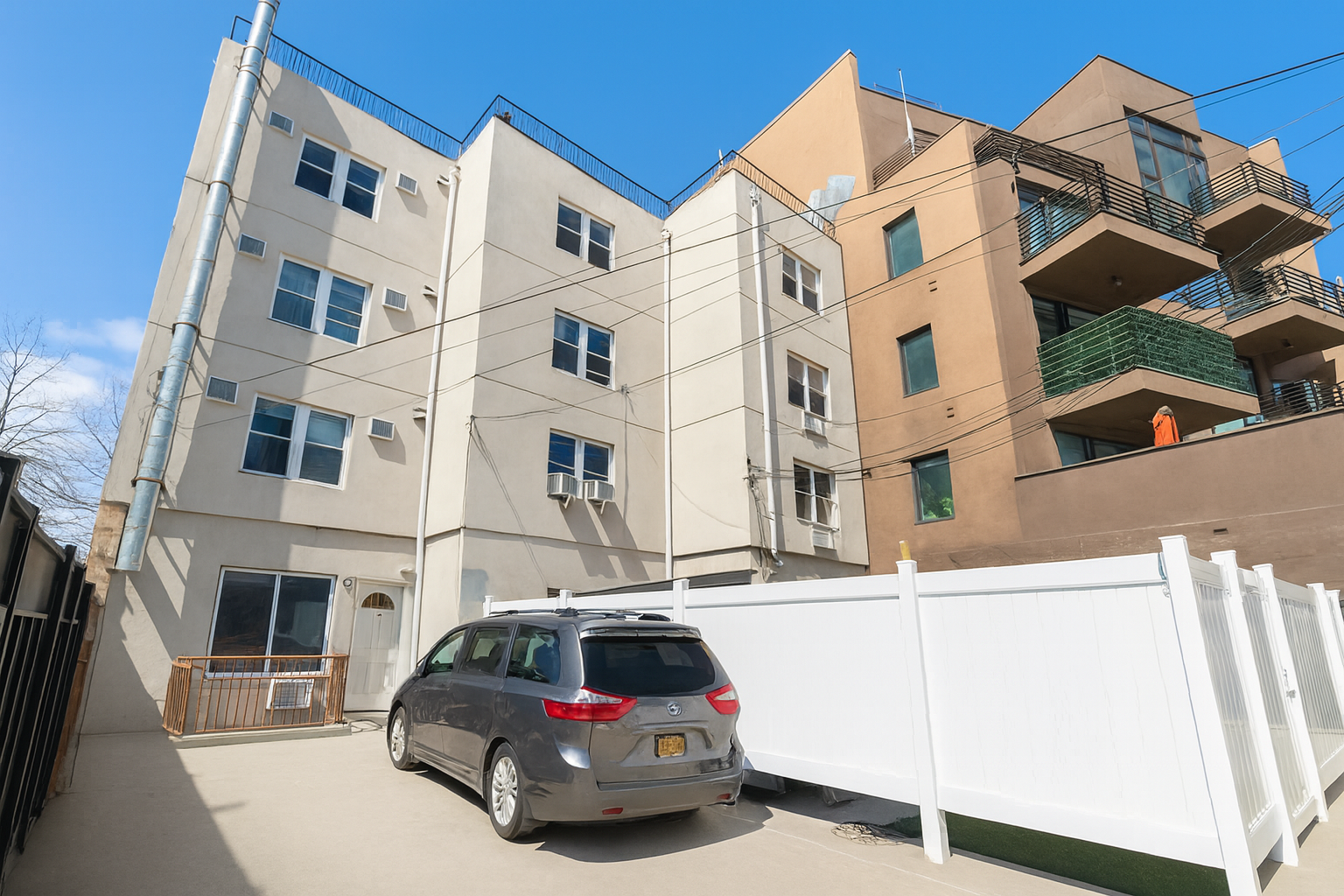 189 Woodpoint Road Brooklyn, NY 11211 - Photo 23 of 26 a car parked in front of a building