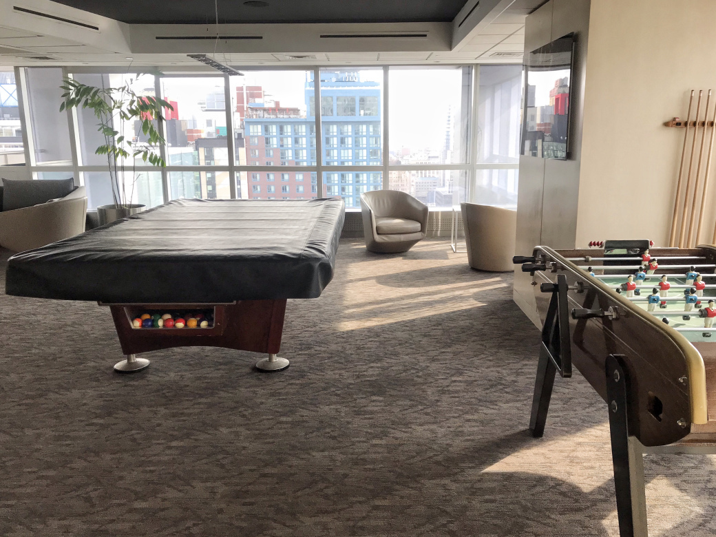 350 West 42nd Street, Unit 20G Manhattan, NY 10036 - Photo 24 of 27 a bed room with a bed and a table