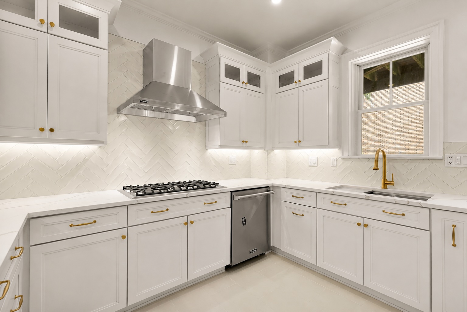 1737 Park Road Northwest Washington, DC 20010 - Photo 9 of 32 a kitchen with white cabinets and white appliances
