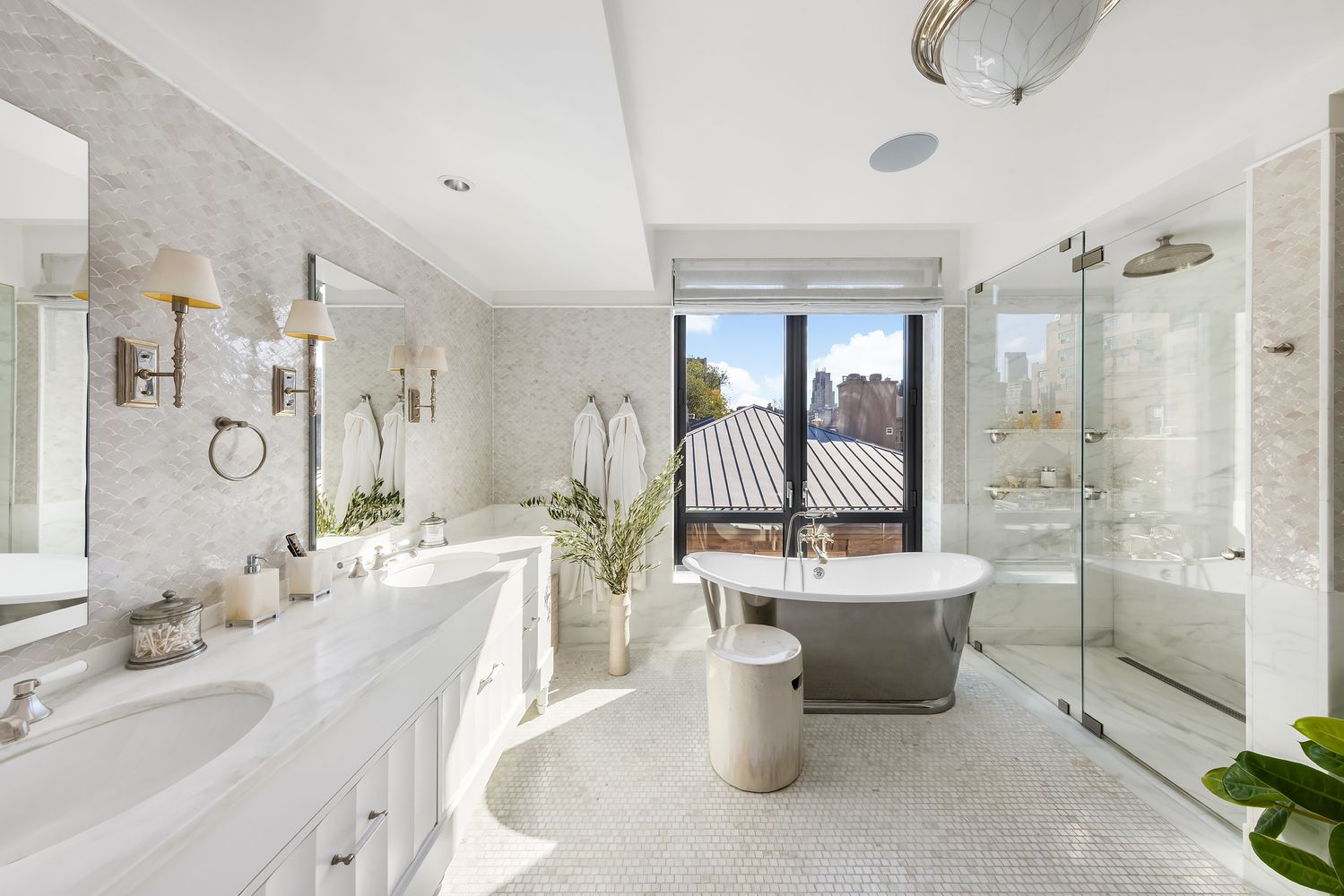 a large bathroom with a double vanity sink toilet mirror and bathtub