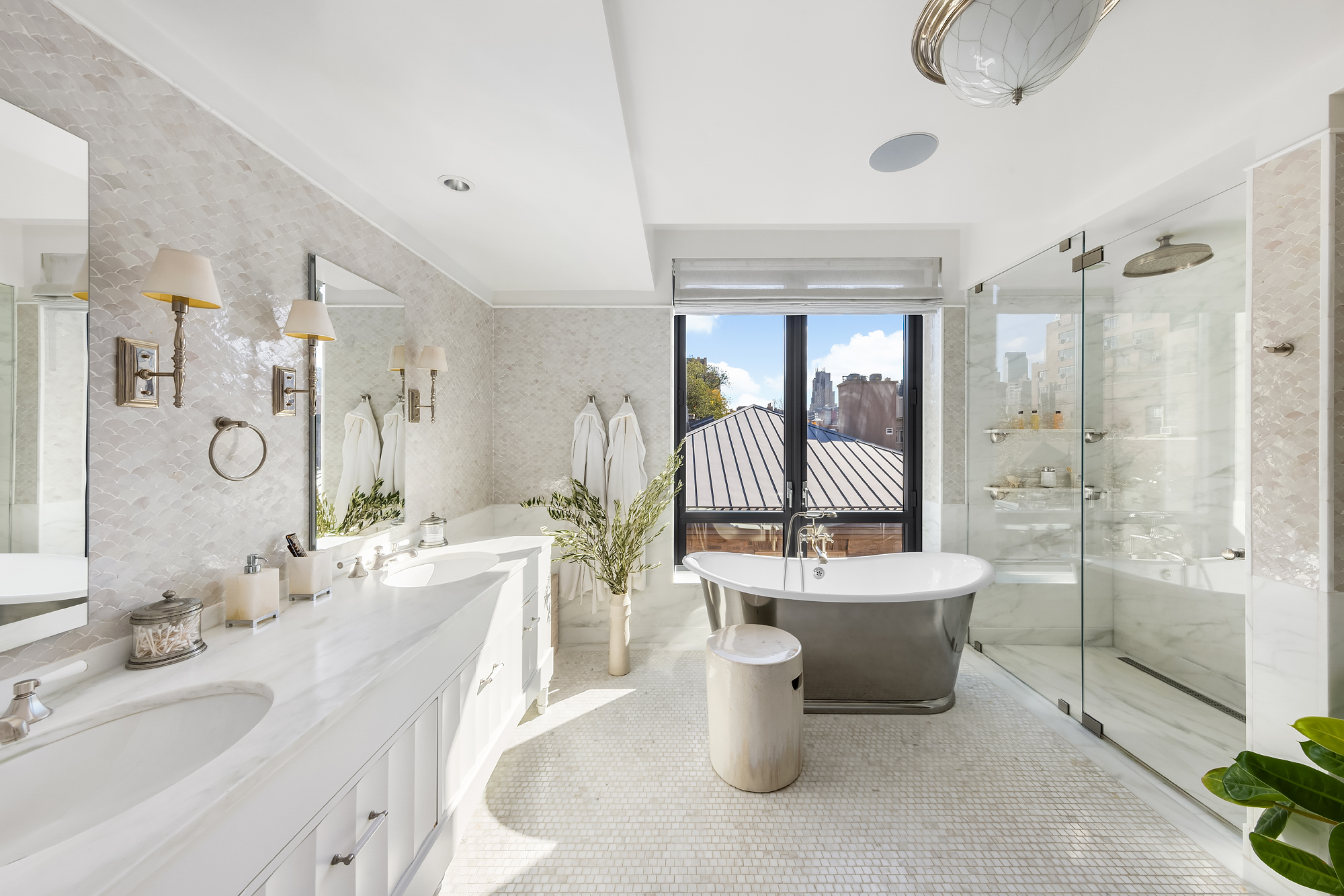 455 West 20th Street, Unit PH Manhattan, NY 10011 - Photo 13 of 21 a large bathroom with a double vanity sink toilet mirror and bathtub