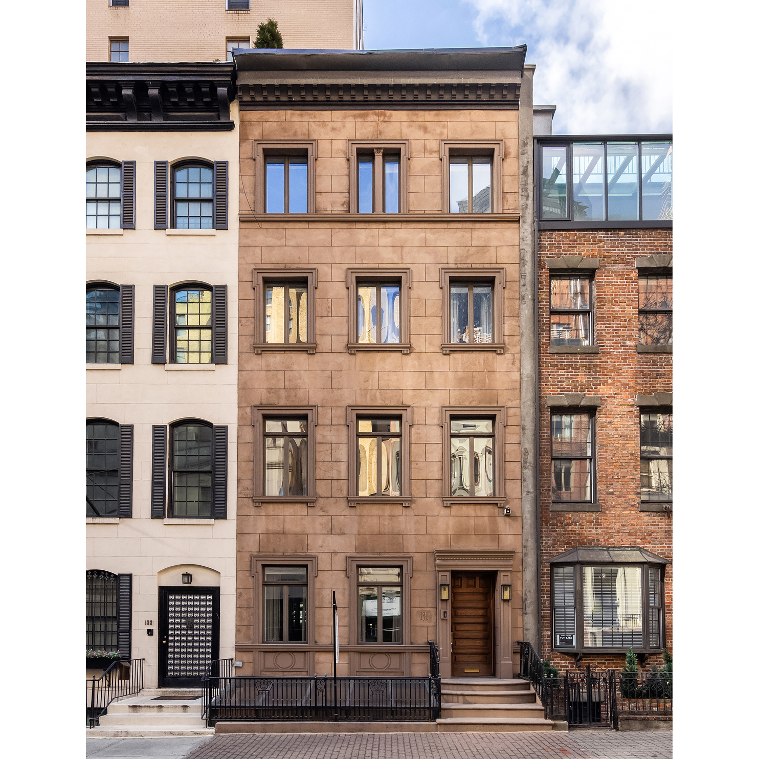 130 East 38th Street Manhattan, NY 10016 - Photo 14 of 16 a front view of a building with windows