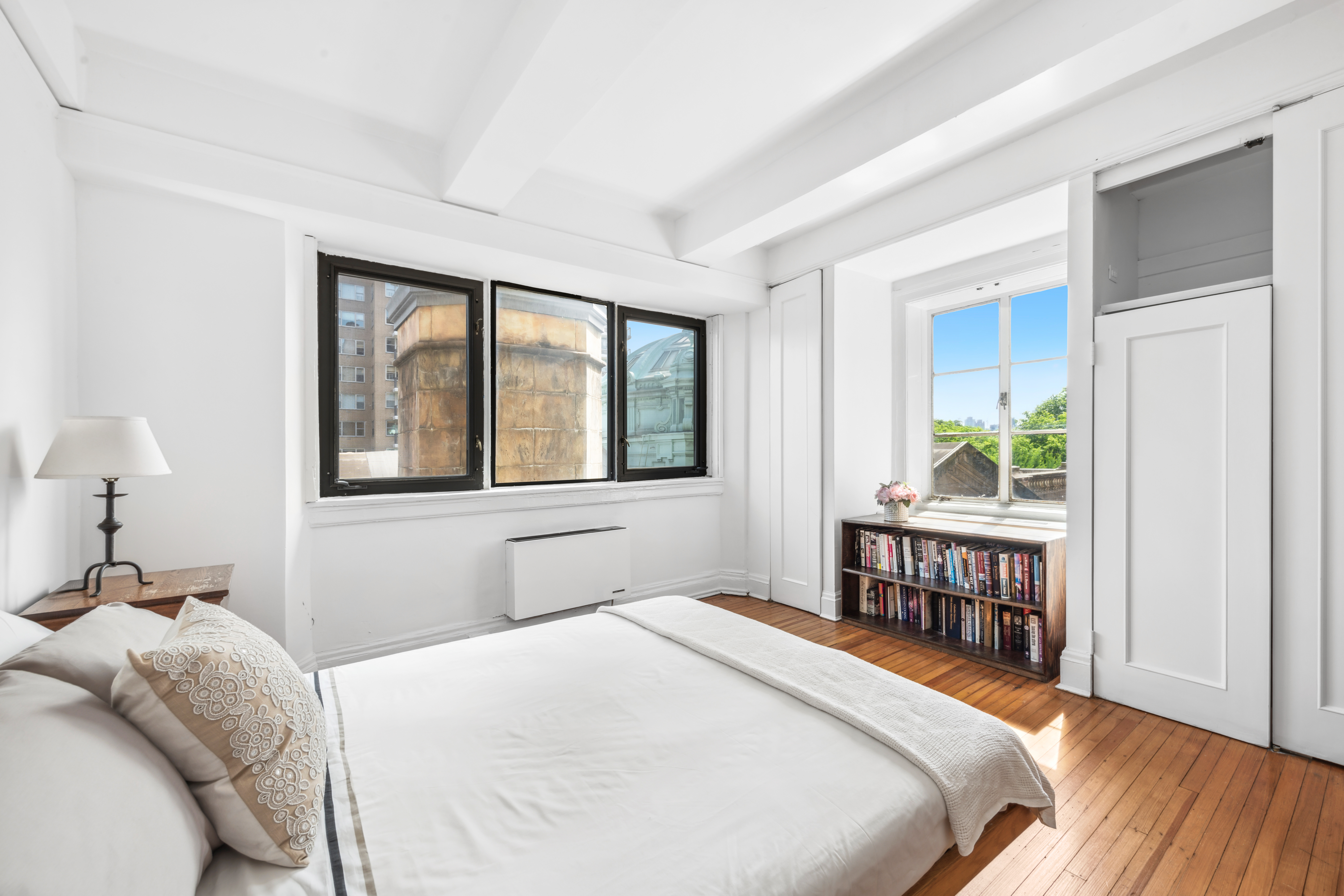 1 West 67th Street, Unit 501/502 Manhattan, NY 10023 - Photo 9 of 19 a bedroom with a bed and a window