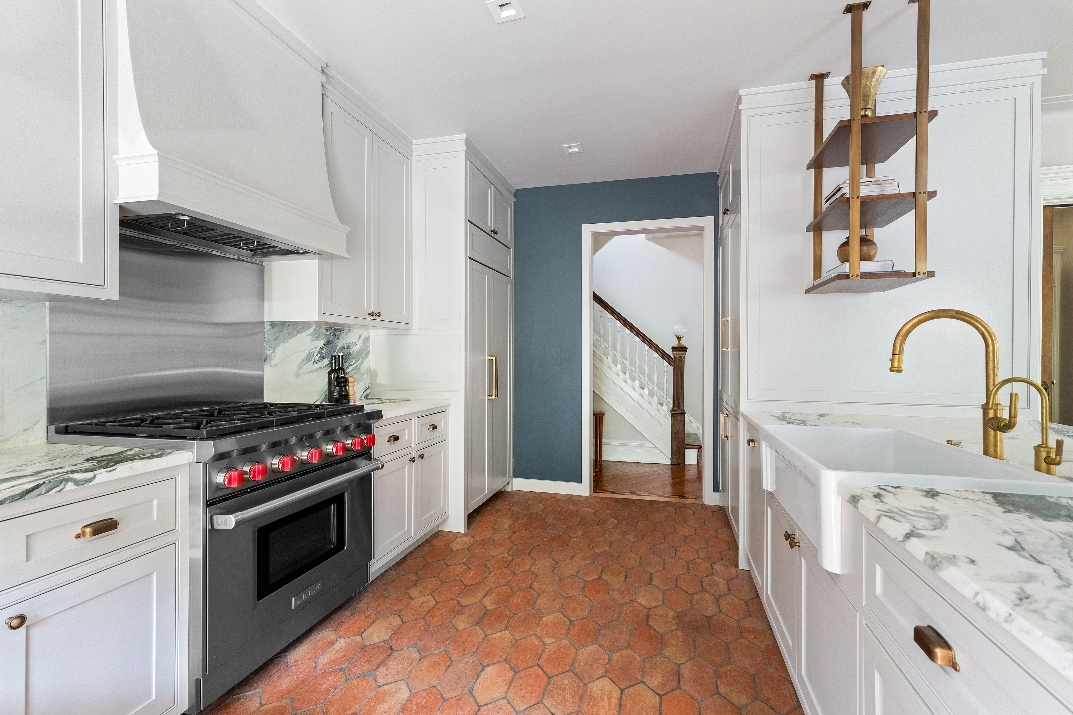 498 Westminster Road Brooklyn, NY 11218 - Photo 10 of 32 a kitchen with stainless steel appliances a stove a sink and a refrigerator