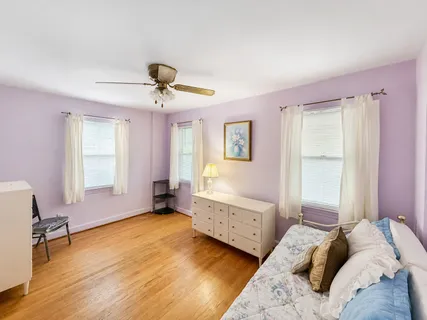 a bedroom with bed and window