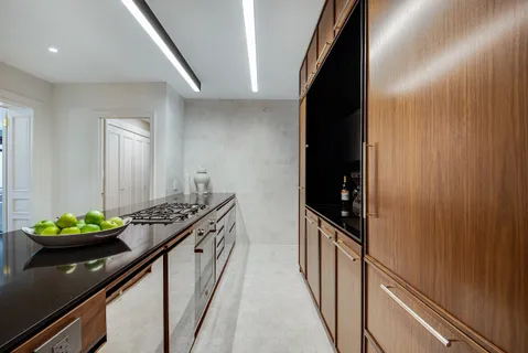 a kitchen with blue cabinets and a stove