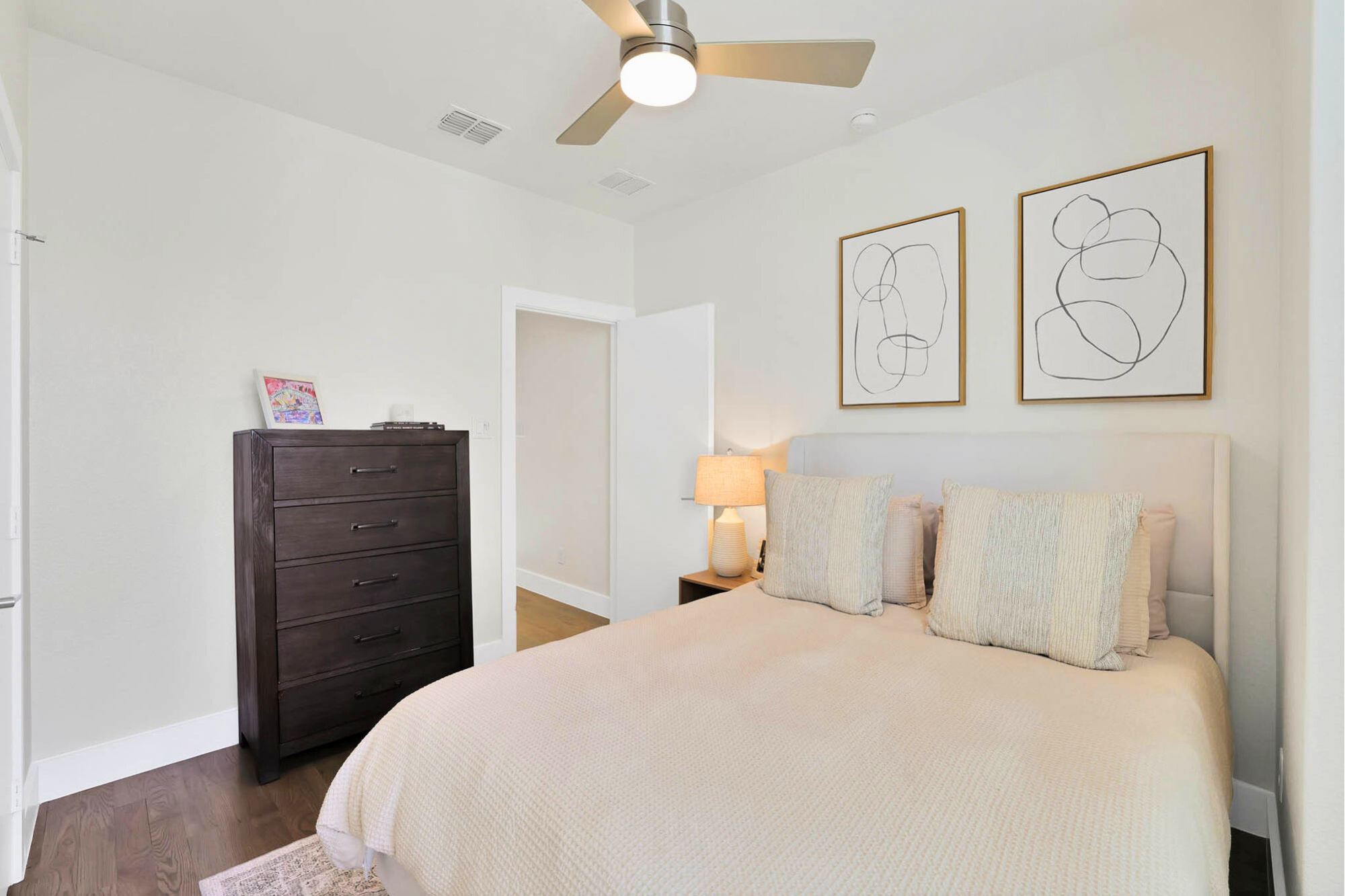 3920 Riesling Ridge Dallas, TX 75204 - Photo 12 of 26 a bedroom with a bed and a painting on the wall