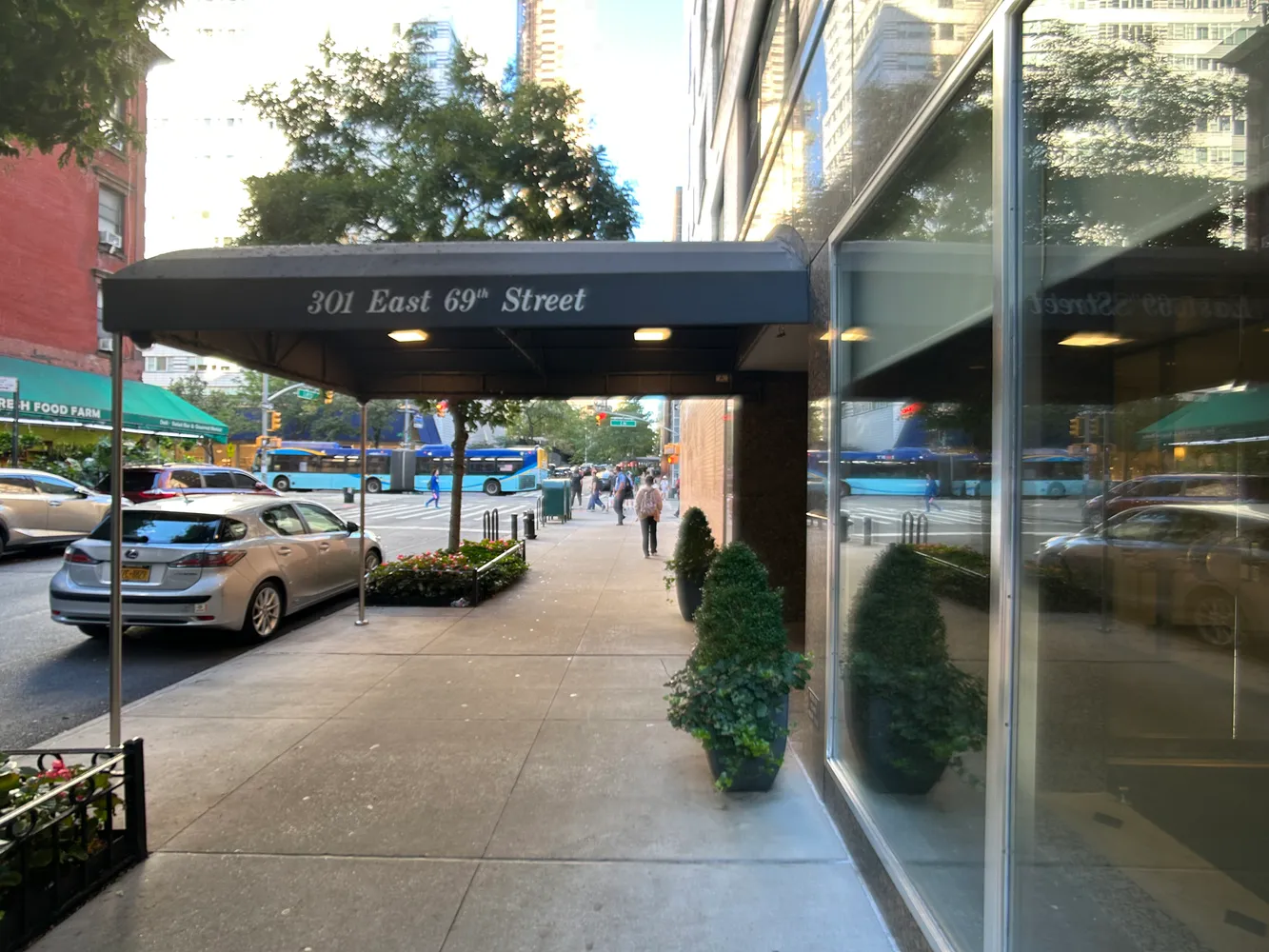 a view of a cars park in front of a building
