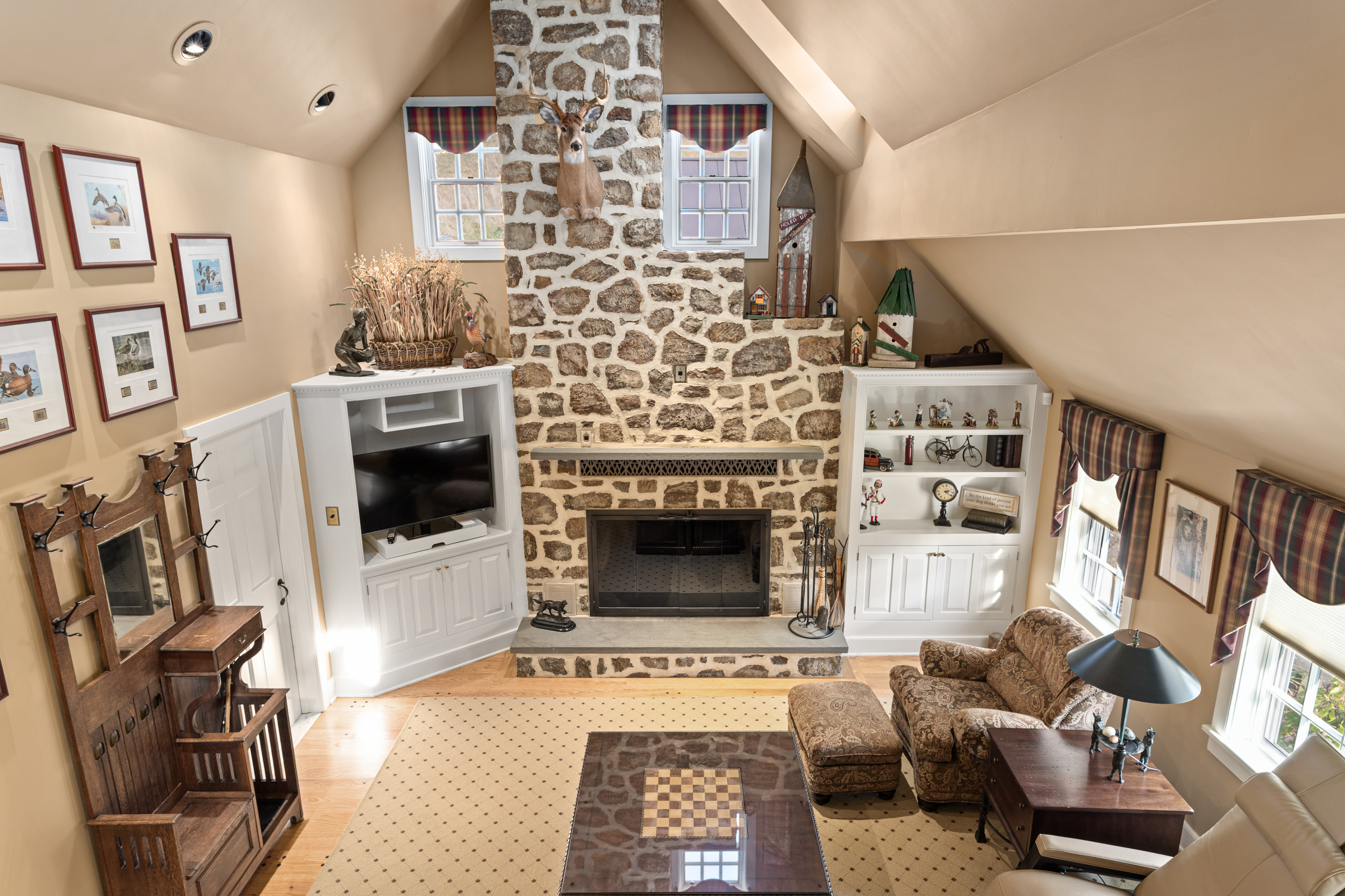 791 Grubbs Mill Road Berwyn, PA 19312 - Photo 22 of 76 a living room with furniture and a fireplace