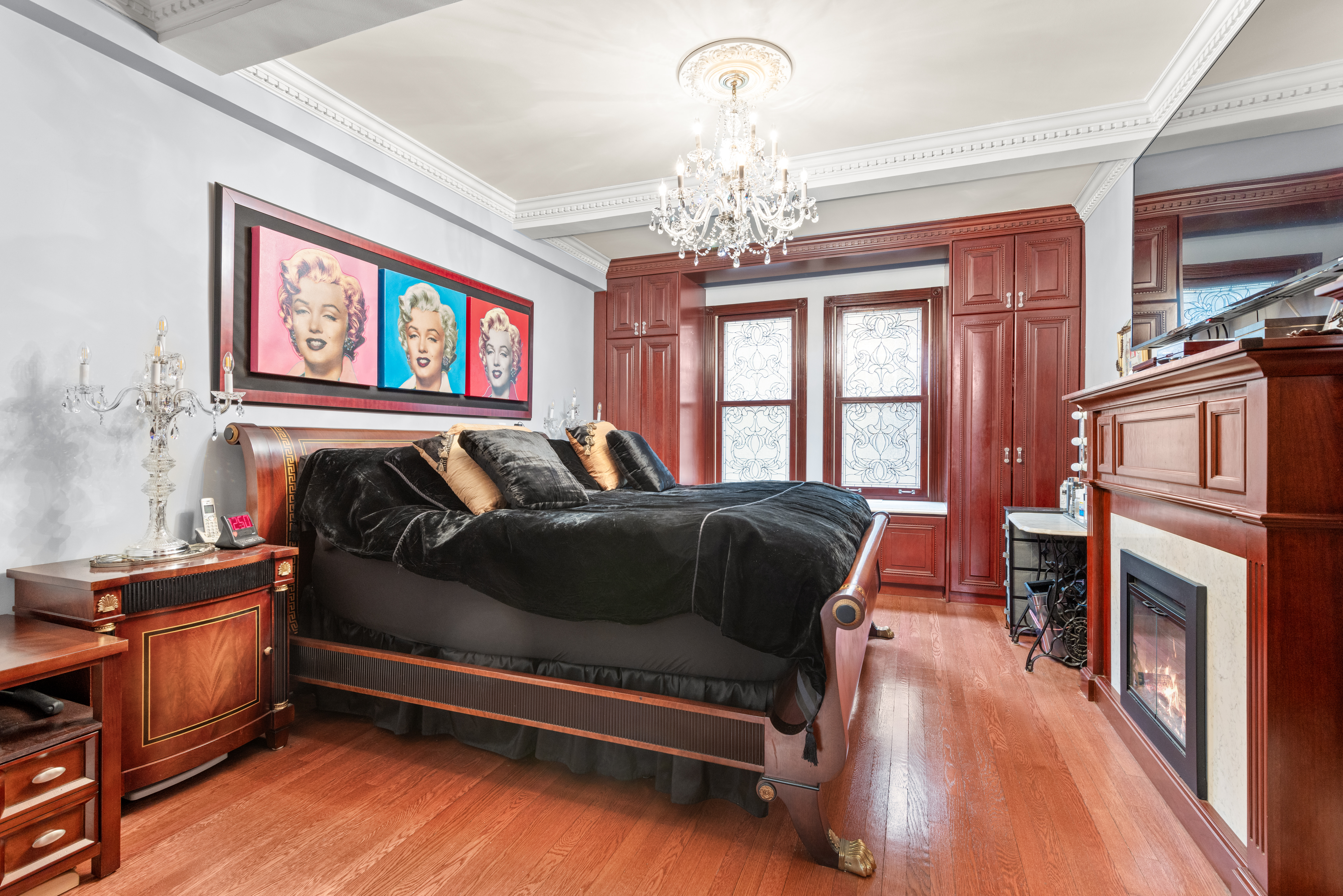 575 Park Avenue, Unit 108 Manhattan, NY 10065 - Photo 6 of 18 a bedroom with a bed and a dresser next to a window