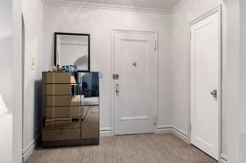 a area with wooden floor and closet