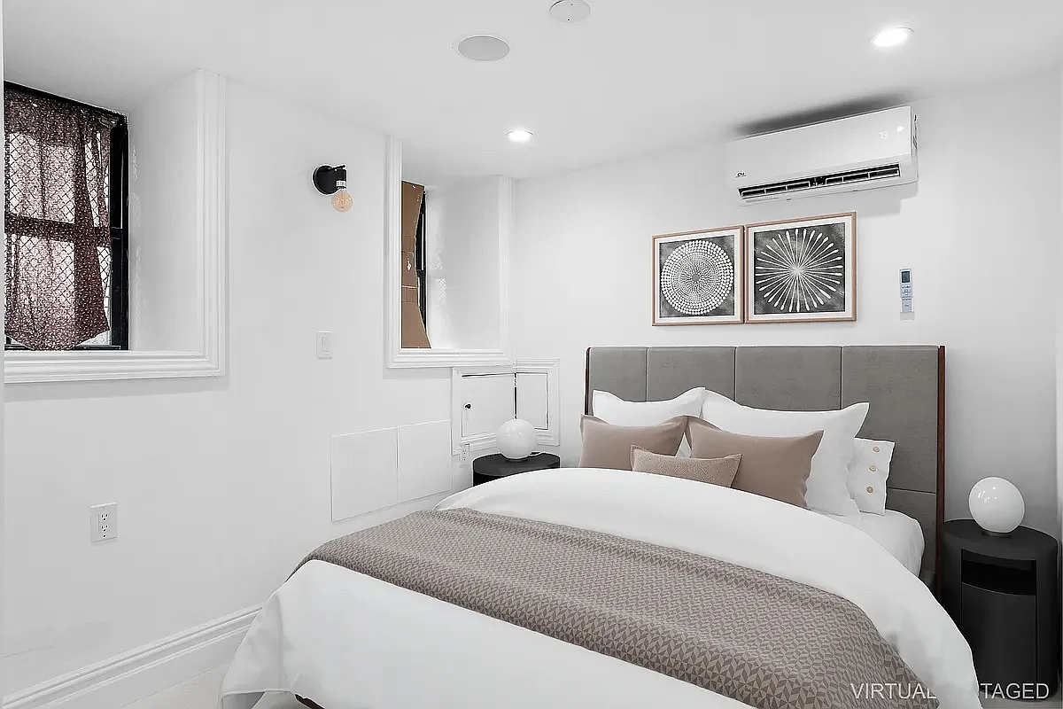 94 Pilling Street, Unit 1 Brooklyn, NY 11207 - Photo 5 of 6 a bedroom with a bed and a window