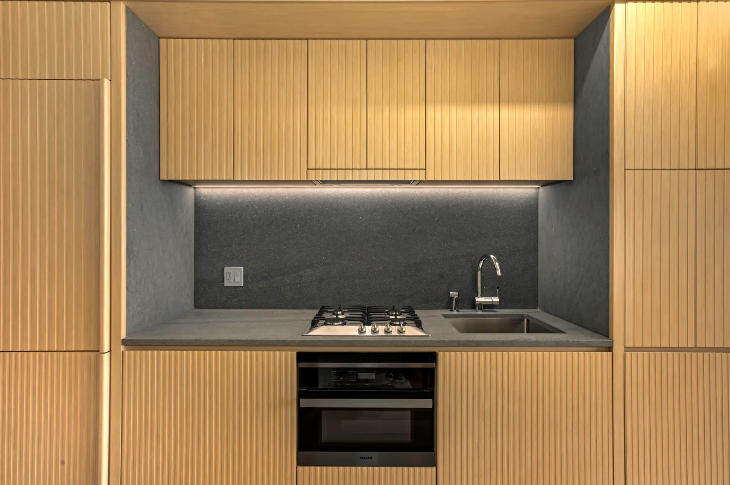 a kitchen with a stove and a refrigerator