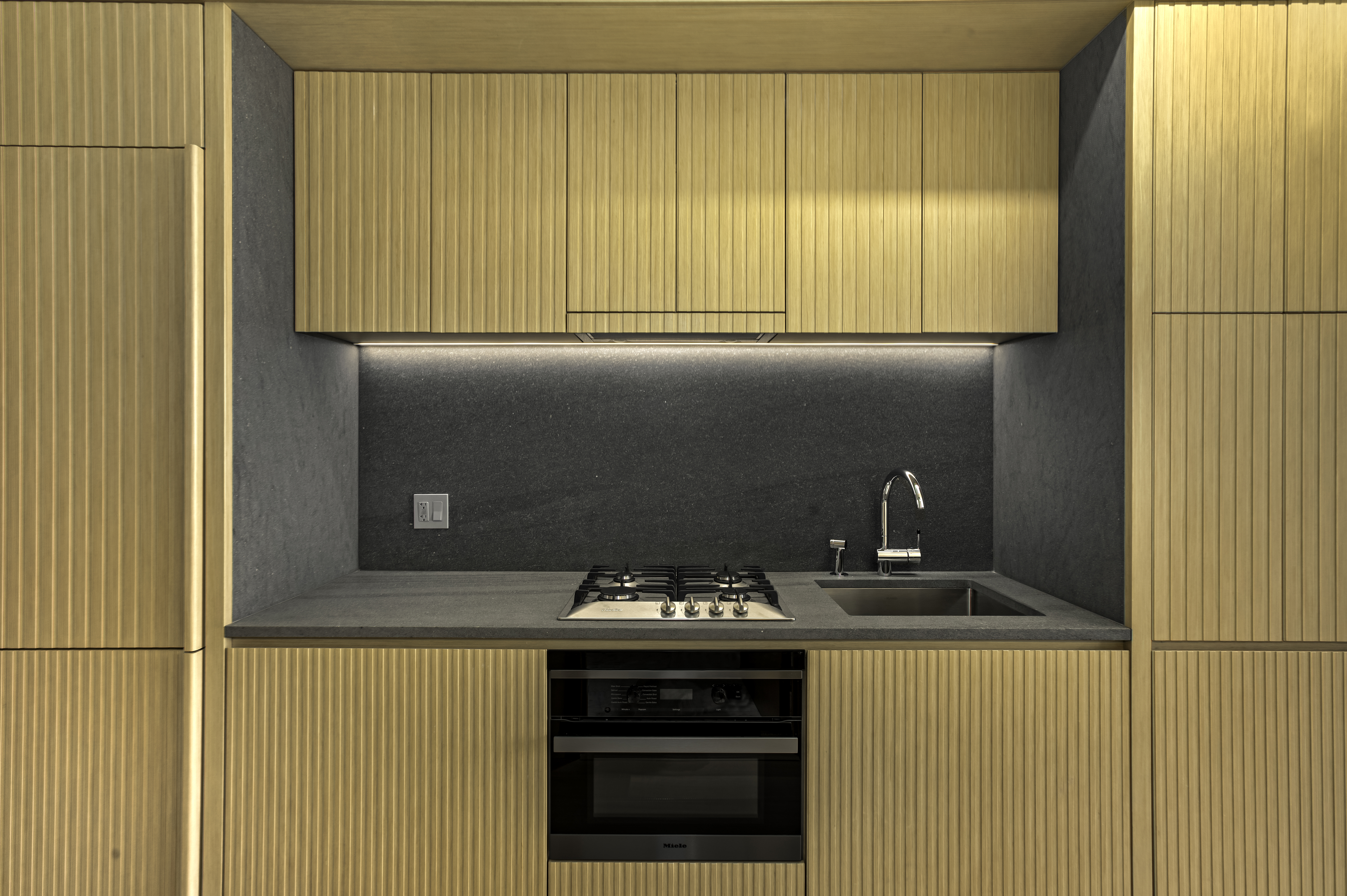 565 Broome Street, Unit S7B Manhattan, NY 10013 - Photo 3 of 13 a kitchen with a stove and a refrigerator