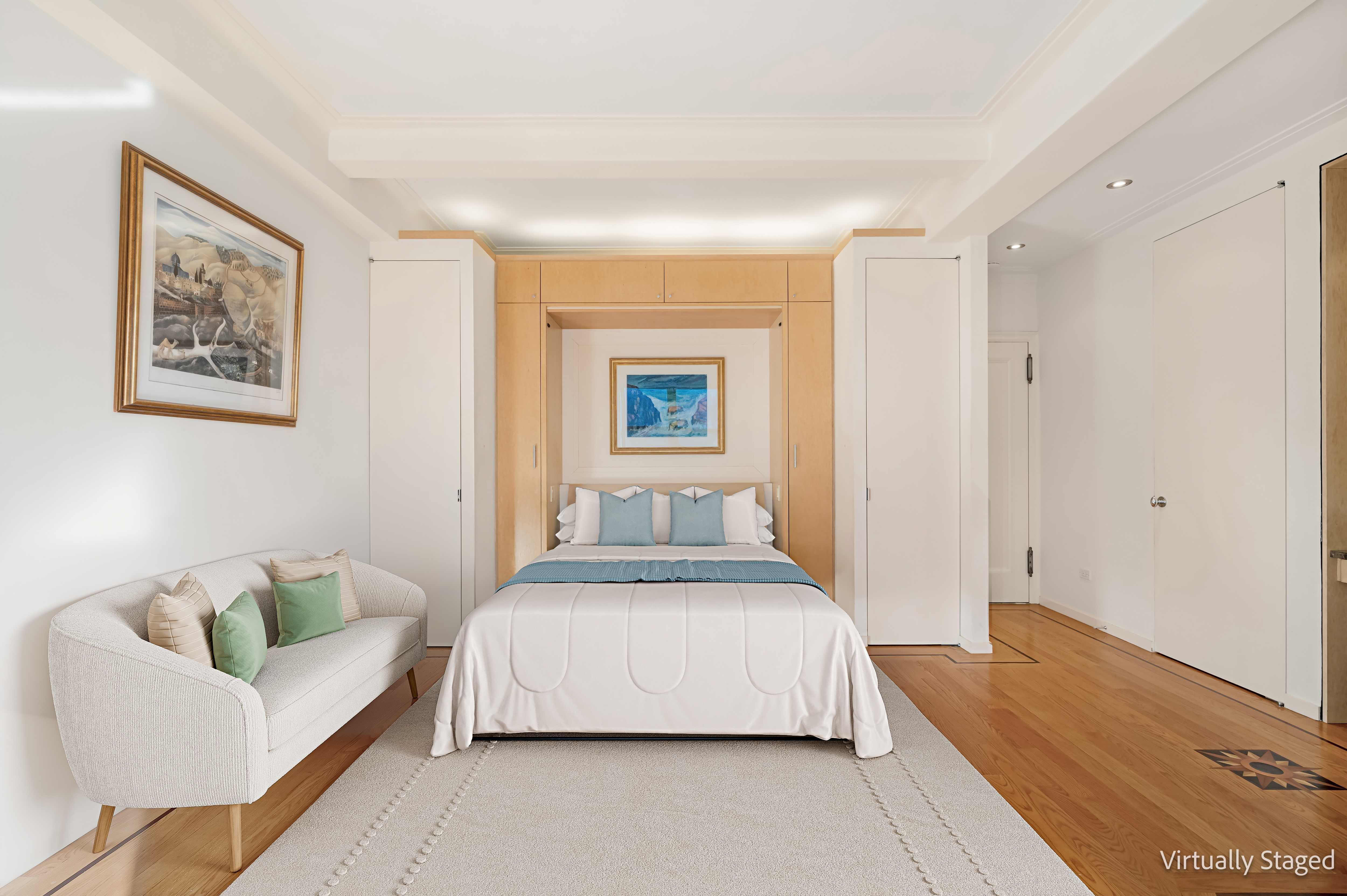7 Park Avenue, Unit 12B Manhattan, NY 10016 - Photo 1 of 10 a bedroom with a bed and a couch