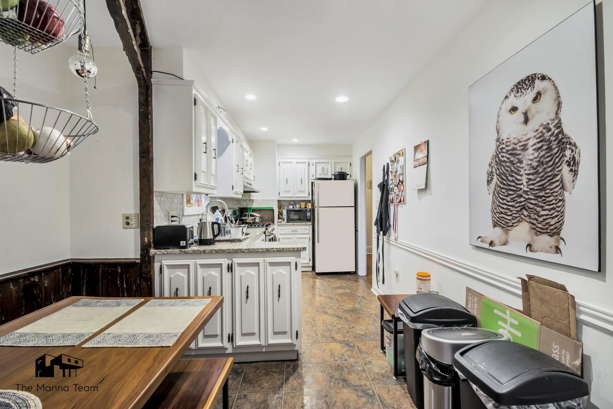 495 Lorimer Street Brooklyn, NY 11211 - Photo 12 of 24 a kitchen with stainless steel appliances kitchen island granite countertop a refrigerator and a stove top oven