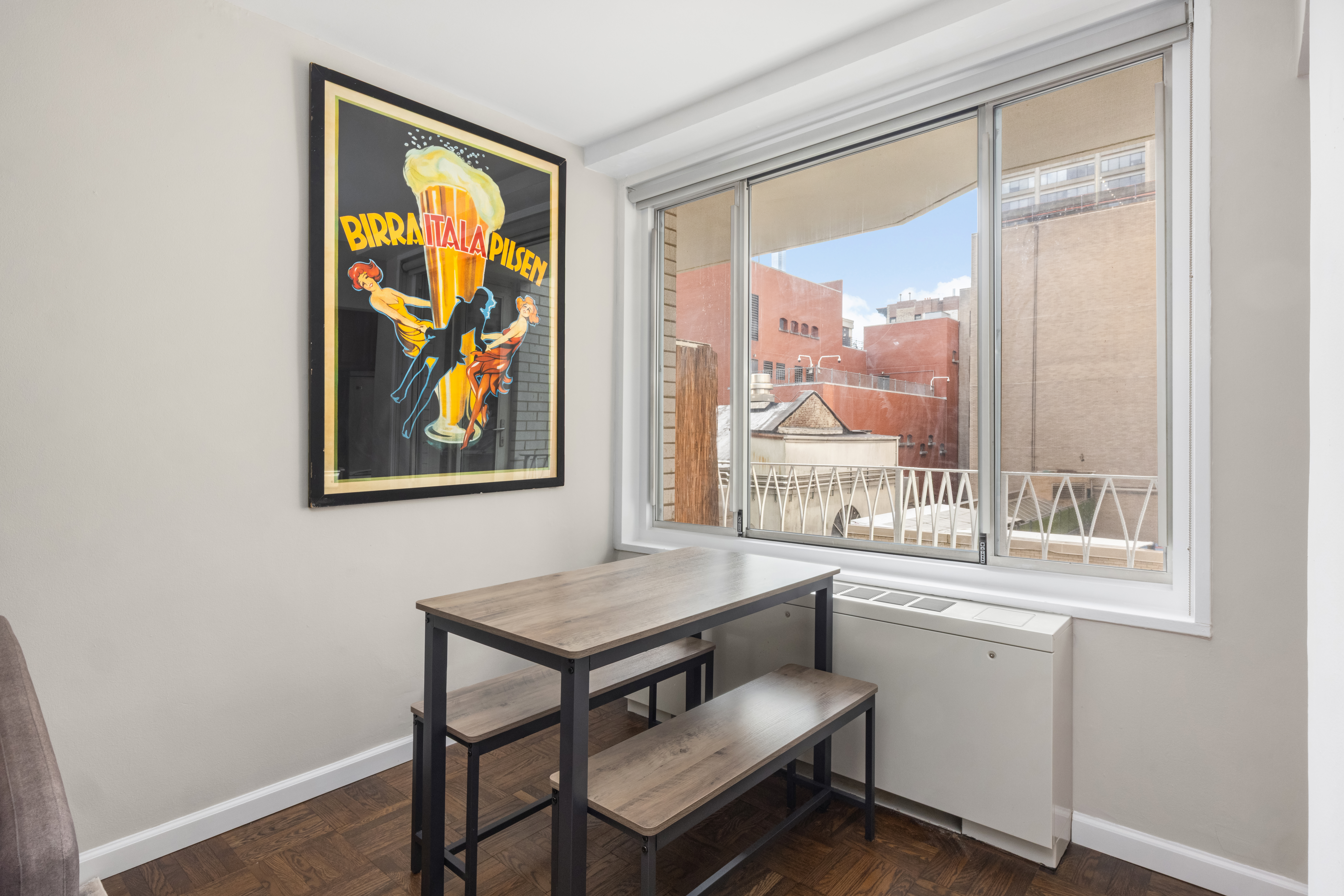 1160 3rd Avenue, Unit 6BC Manhattan, NY 10065 - Photo 3 of 13 a room with a table and a window