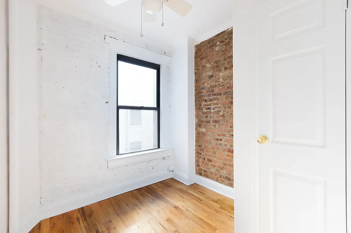 649 East 9th Street, Unit D3 Manhattan, NY 10009 - Photo 4 of 5 a view of an empty room with a window
