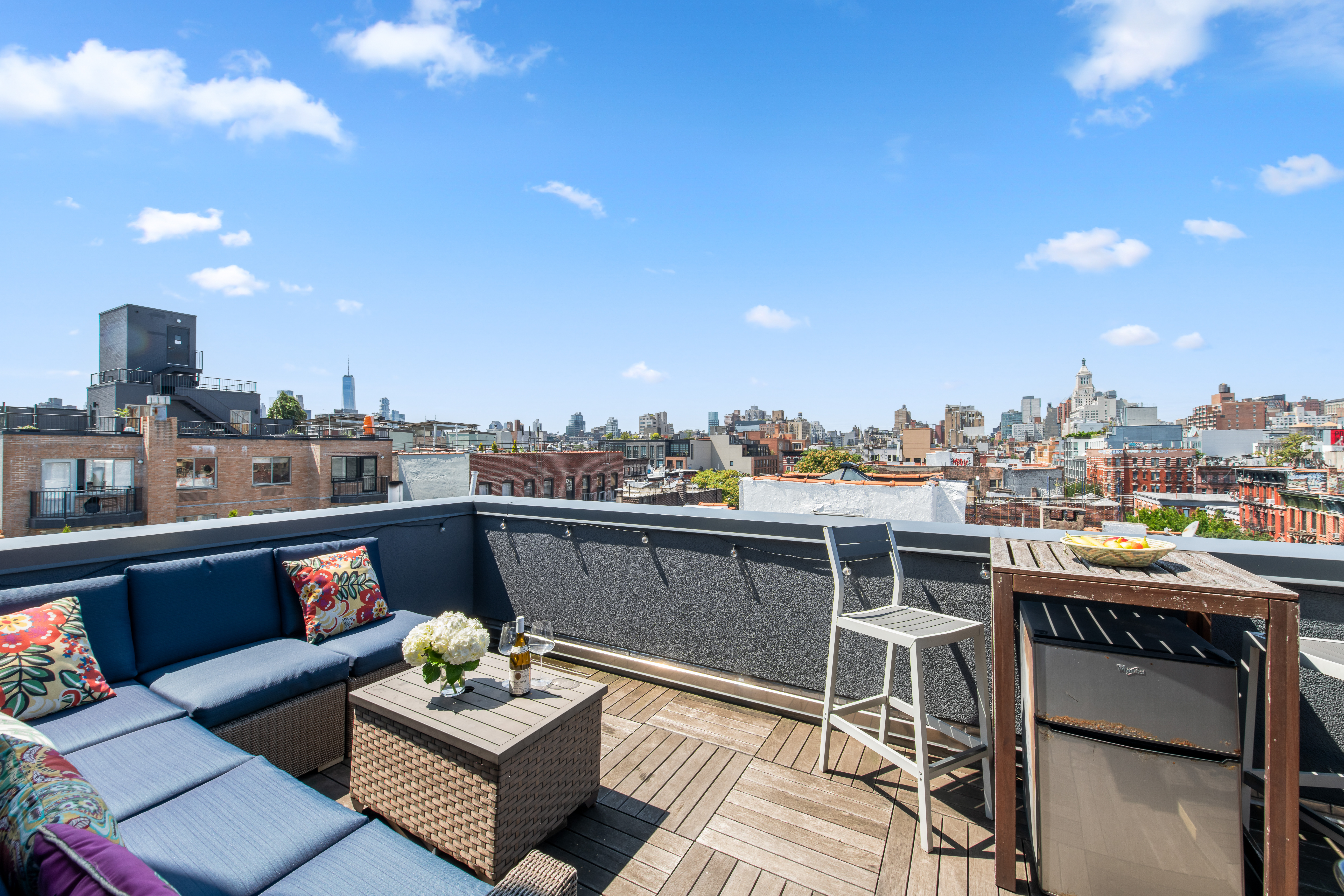 536 East 13th Street, Unit 5F Manhattan, NY 10009 - Photo 13 of 16 a view of a roof deck with couches and potted plants
