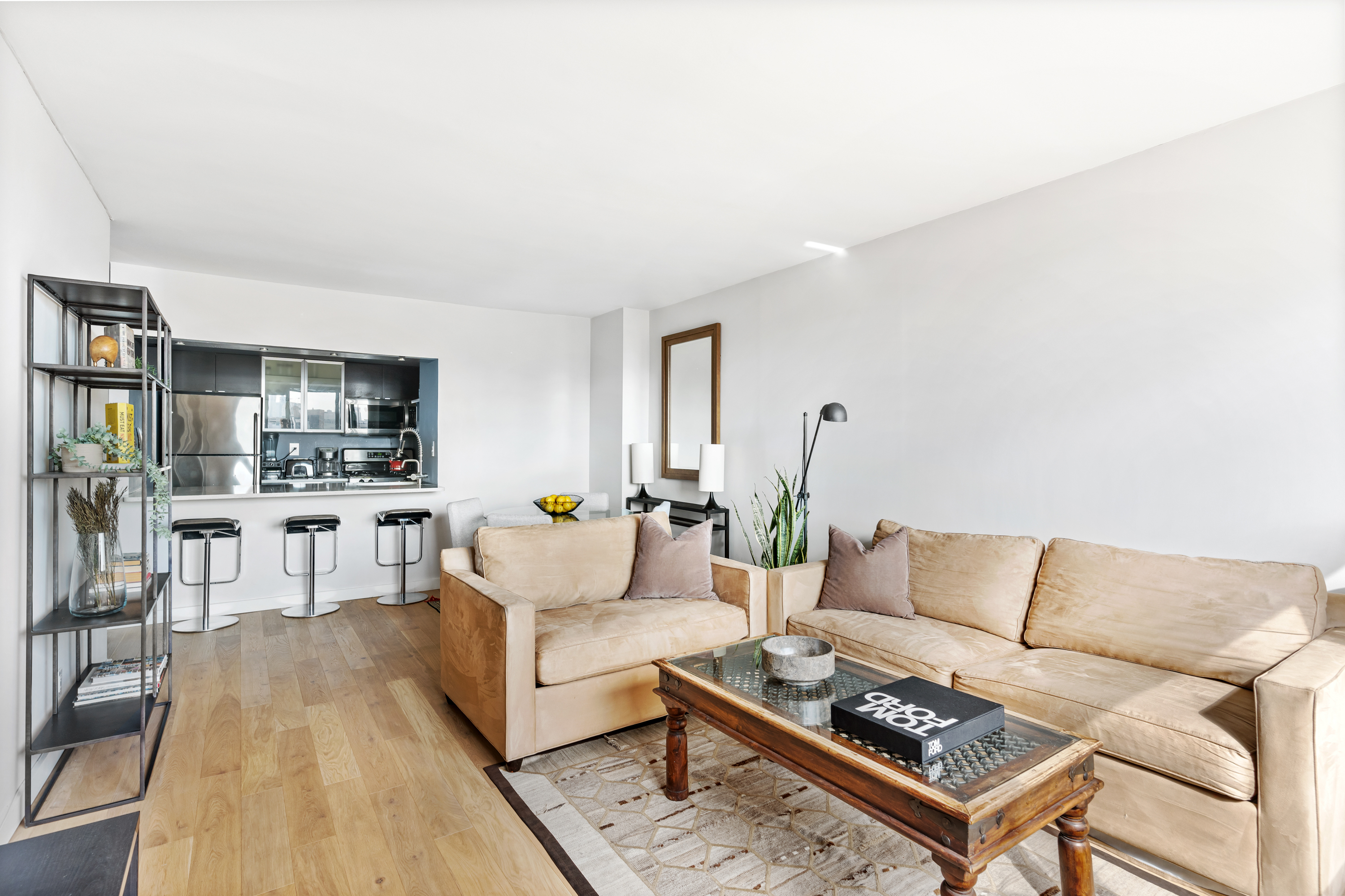 1 Irving Place, Unit U21E Manhattan, NY 10003 - Photo 2 of 16 a living room with furniture and view of kitchen