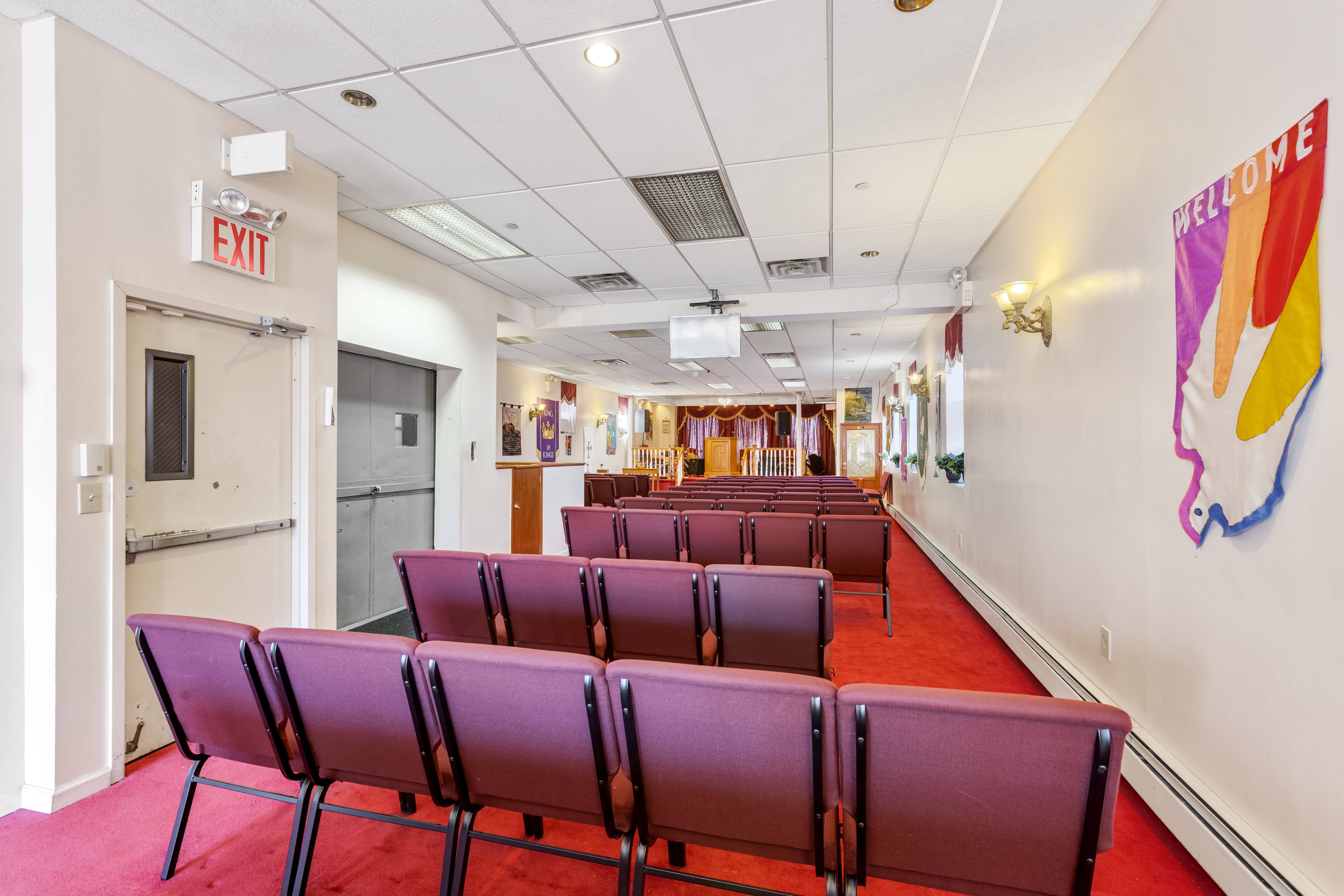 130 Watkins Street Brooklyn, NY 11212 - Photo 5 of 11 a living room with furniture a ceiling fan and a rug