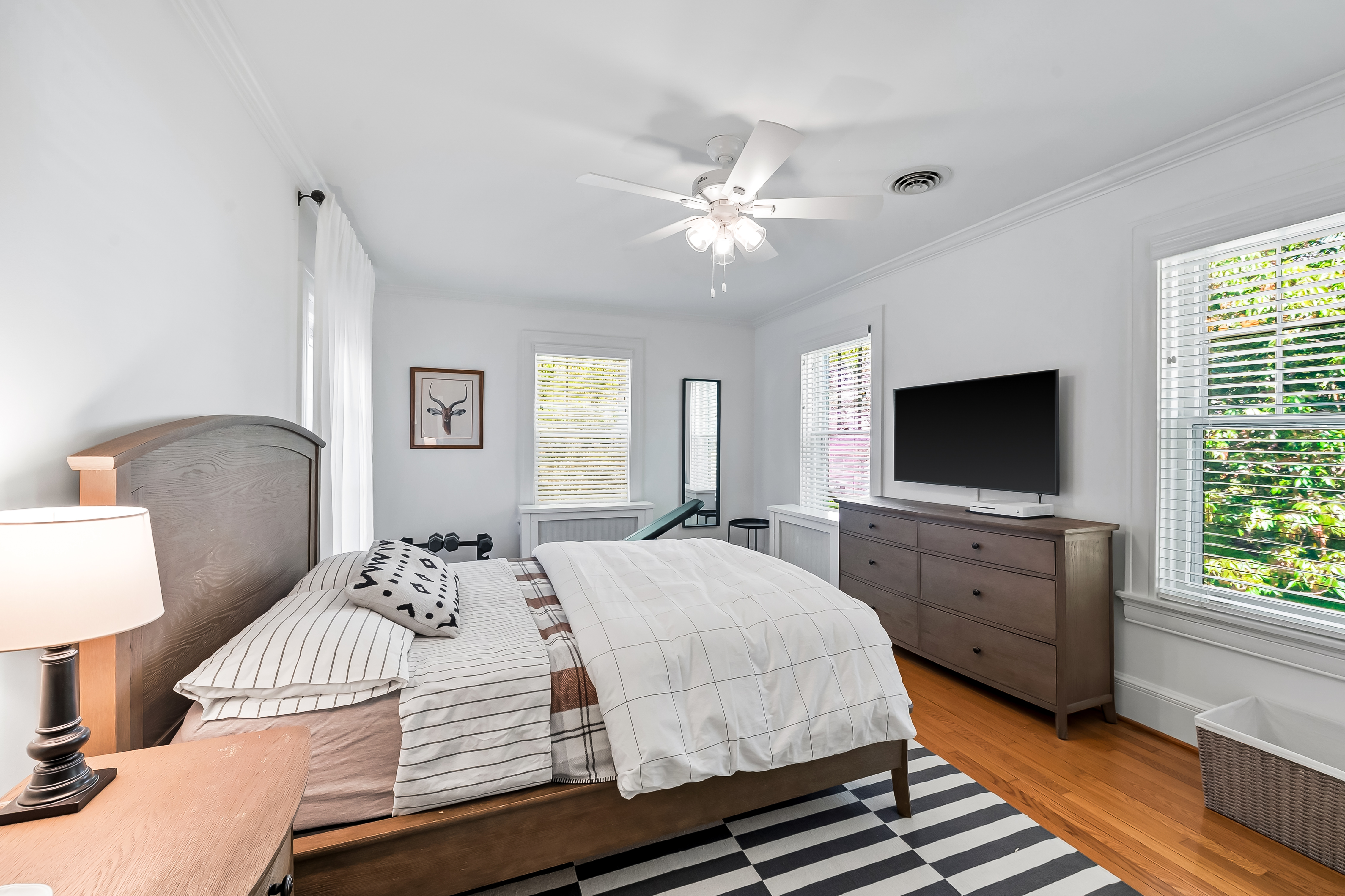 6 Elmhurst Road Baltimore, MD 21210 - Photo 80 of 100 a bedroom with a bed and a flat screen tv
