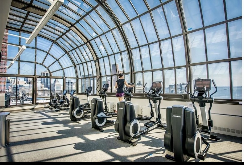 200 Rector Place, Unit 2C Manhattan, NY 10280 - Photo 12 of 19 a view of a room with gym equipment