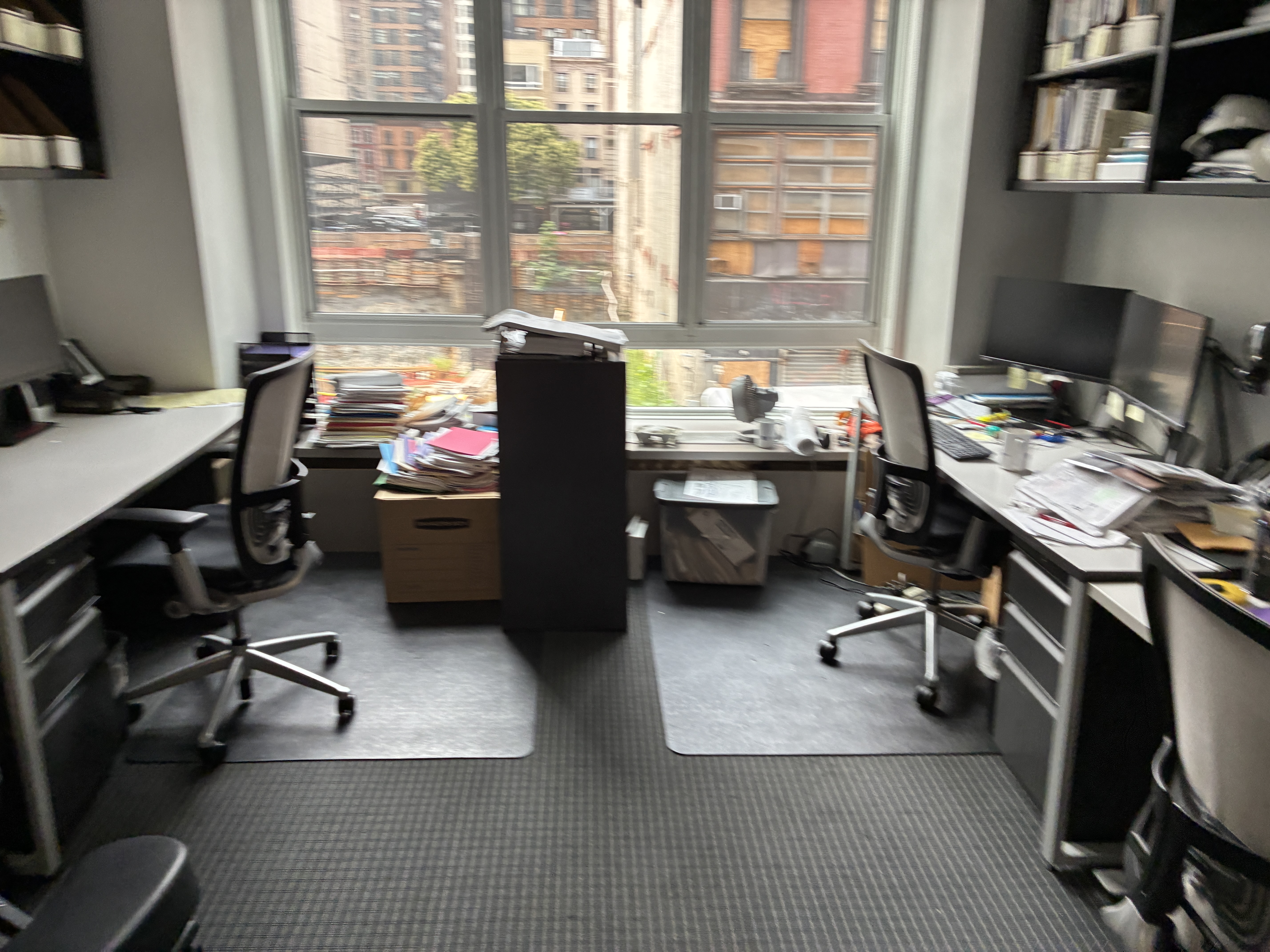 11 West 30th Street, Unit 2F Manhattan, NY 10001 - Photo 9 of 20 a view of a workspace with furniture and a window