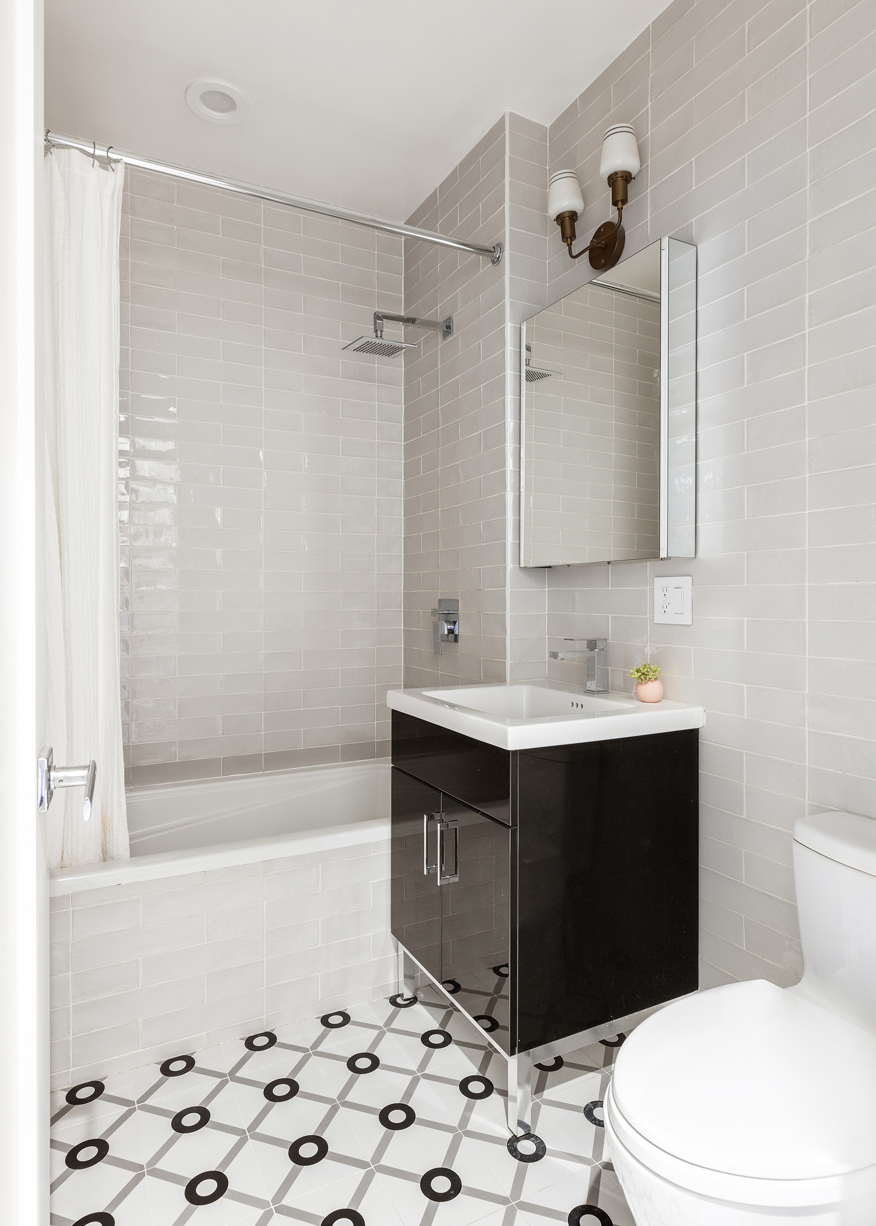 207 Wyckoff Street, Unit 2 Brooklyn, NY 11217 - Photo 12 of 15 a bathroom with a sink toilet and shower