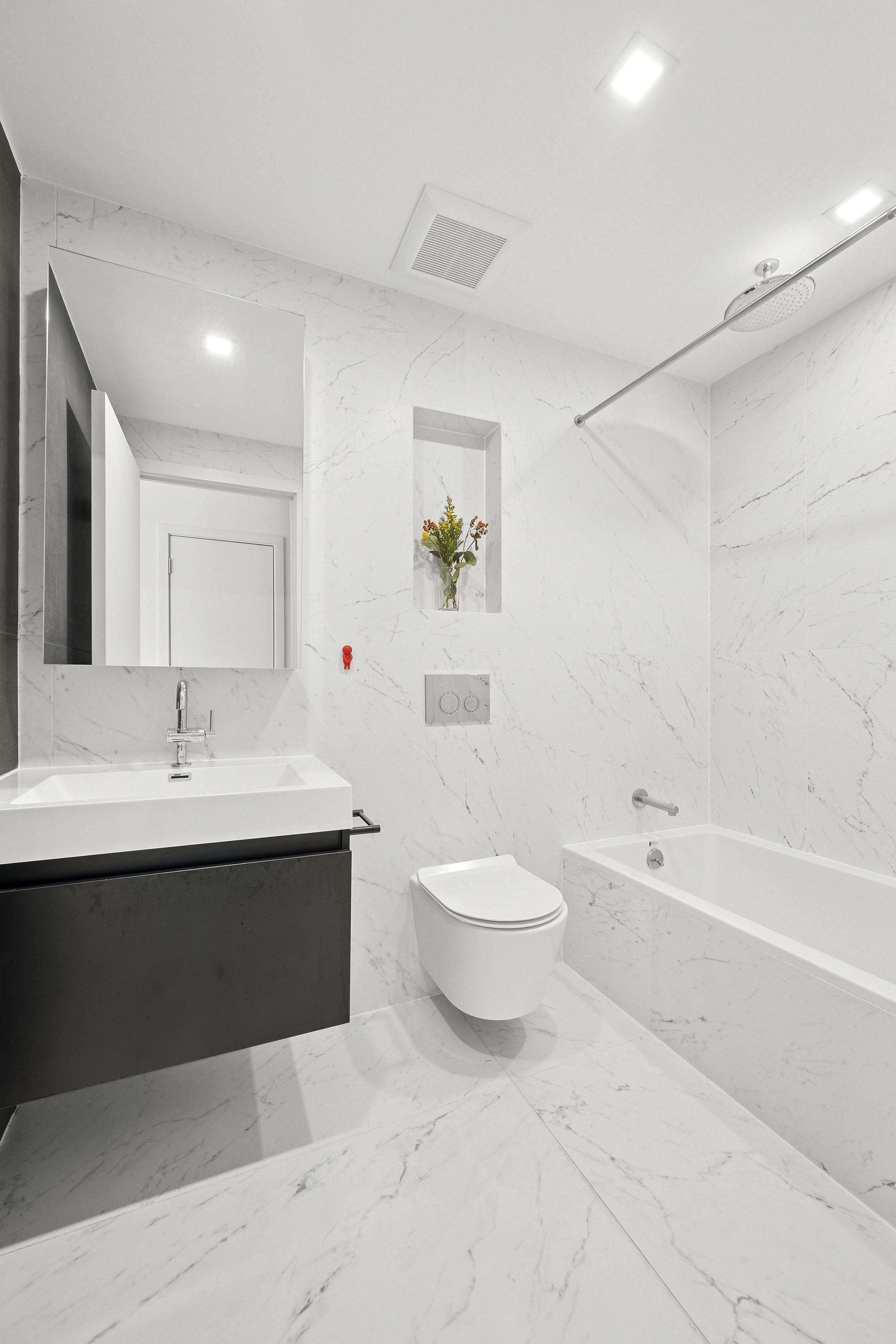 156 Devoe Street, Unit 3F Brooklyn, NY 11211 - Photo 7 of 9 a bathroom with a sink a toilet and a bathtub