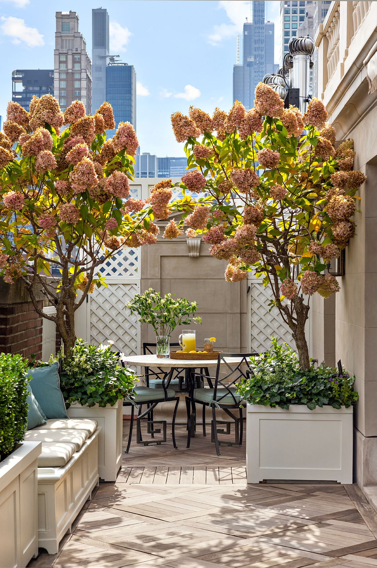 620 Park Avenue, Unit 14 Manhattan, NY 10065 - Photo 2 of 32 a view of a patio with table and chairs and potted plants
