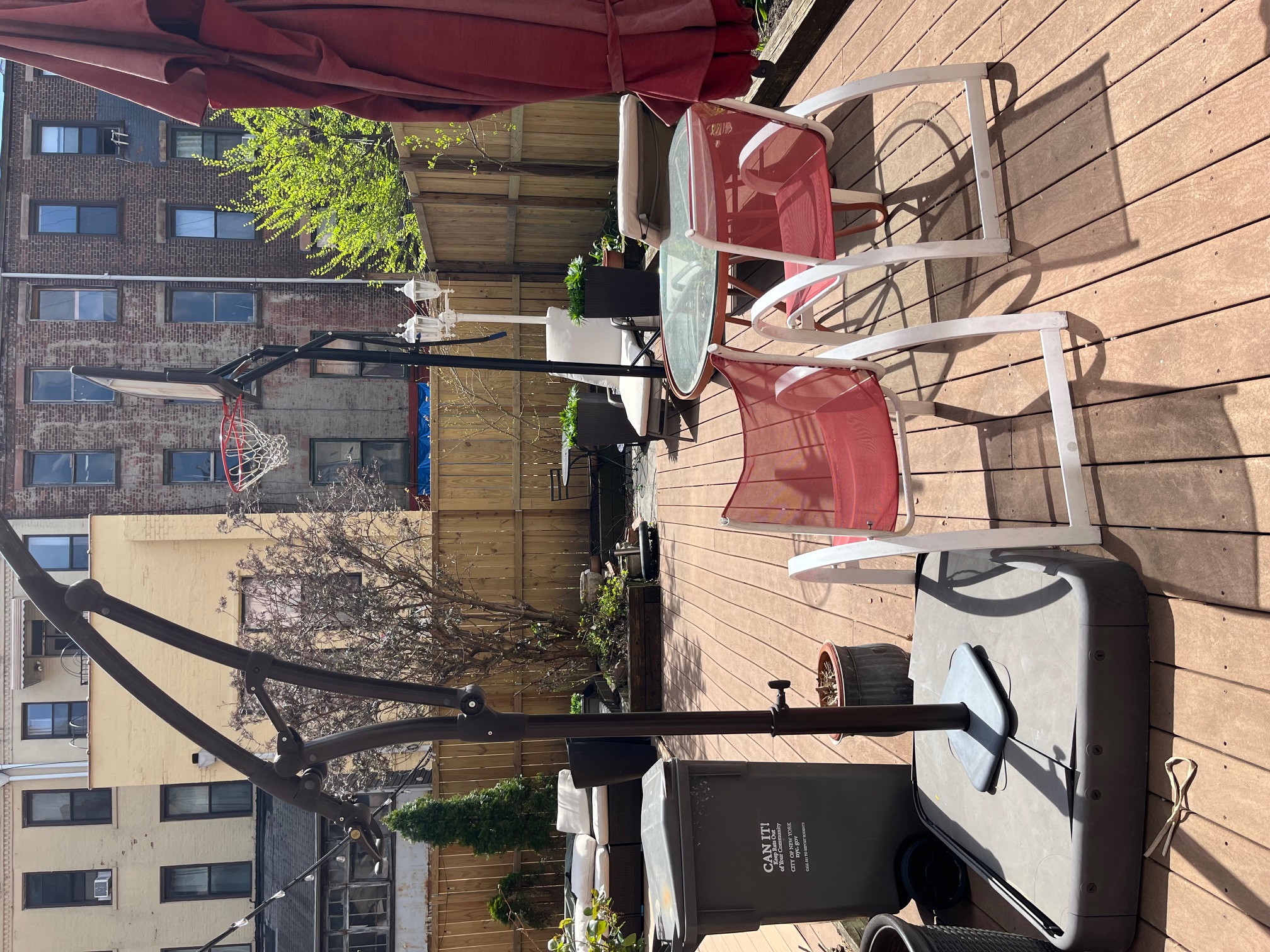 106 West 131st Street Manhattan, NY 10027 - Photo 5 of 16 a backyard of a house with barbeque oven table and chairs