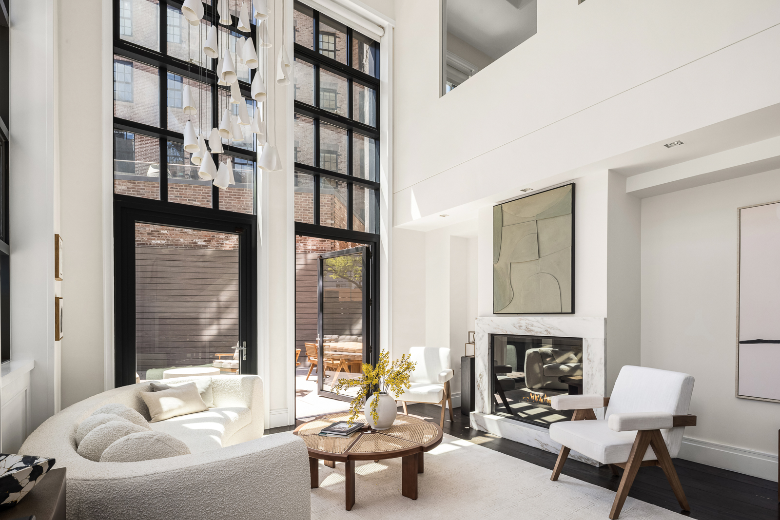 137 Franklin Street, Unit 1 Manhattan, NY 10013 - Photo 1 of 25 a living room with furniture fireplace and a fireplace
