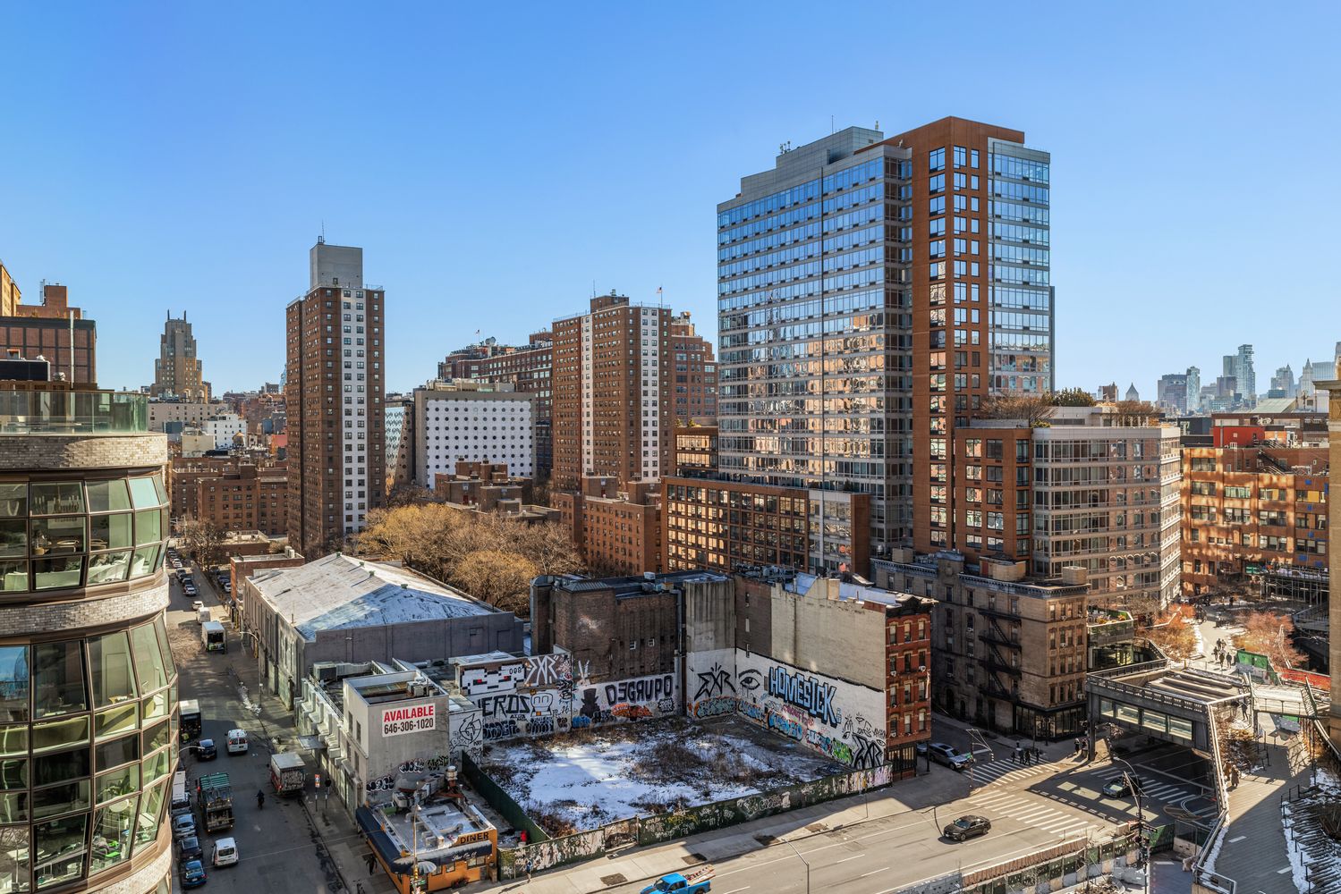a view of city with a tall building