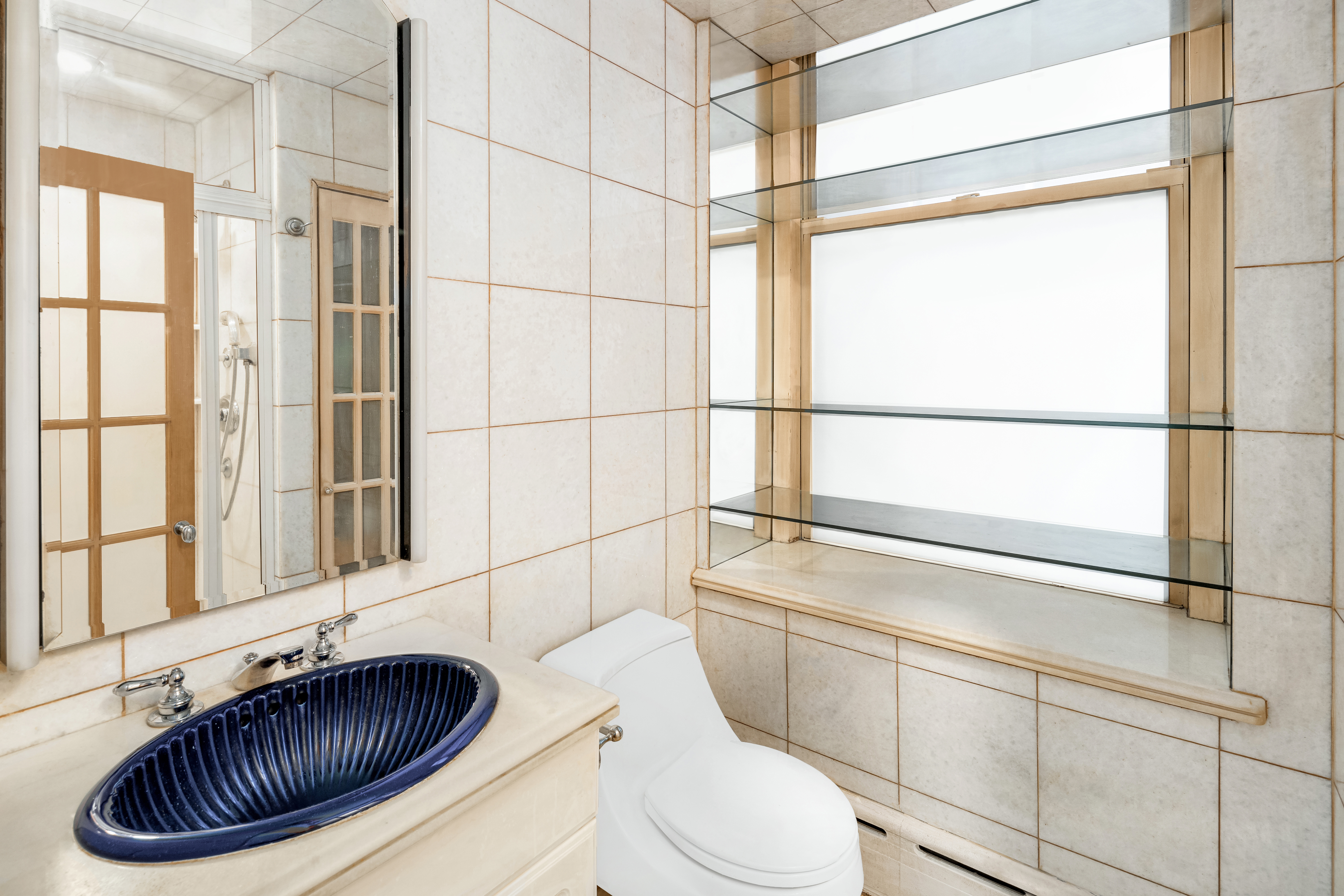 131 Mercer Street, Unit 2B Manhattan, NY 10012 - Photo 14 of 18 a bathroom with a toilet a sink and a bathtub