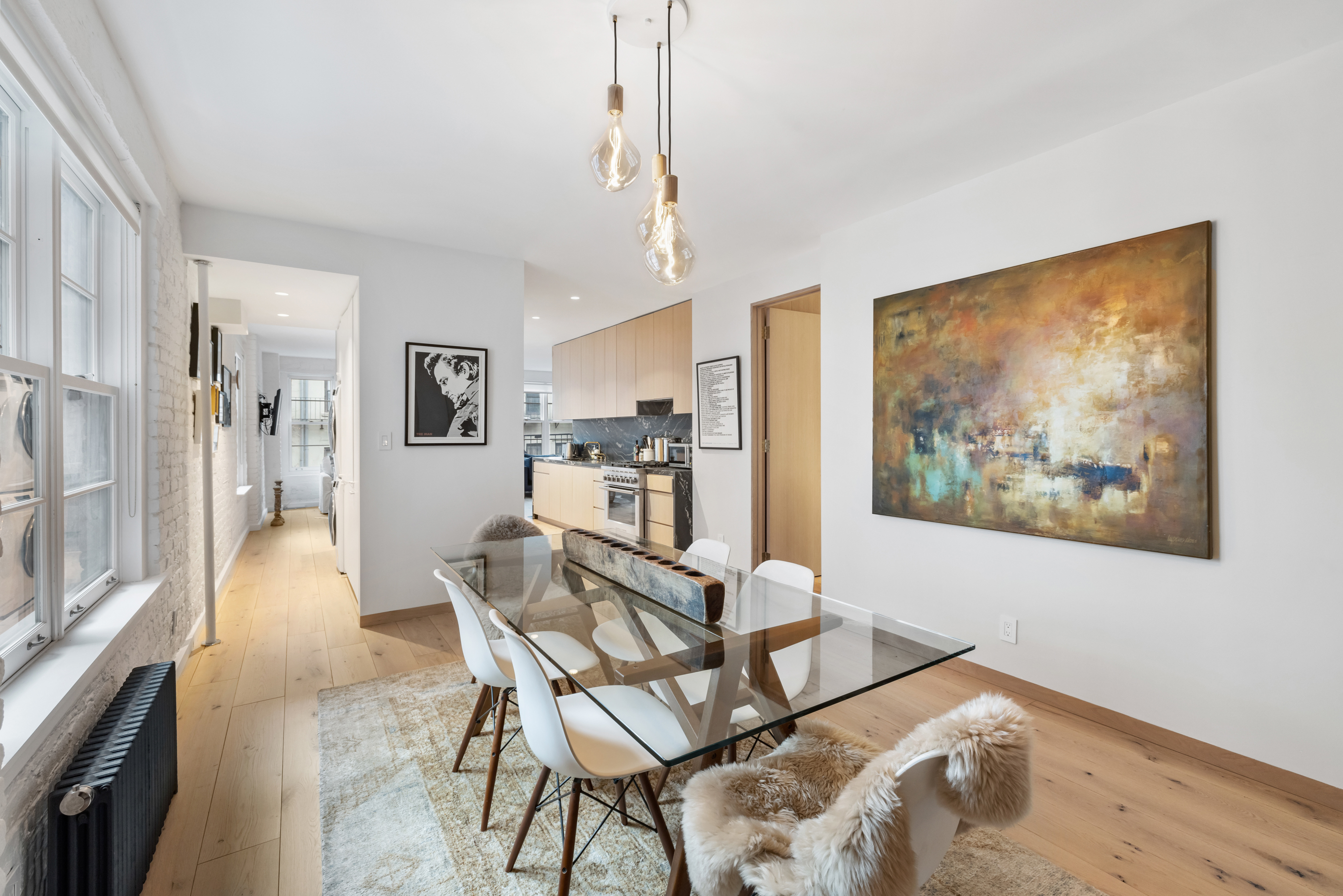 57 Thompson Street, Unit 4E Manhattan, NY 10012 - Photo 2 of 16 a dining room with furniture and window