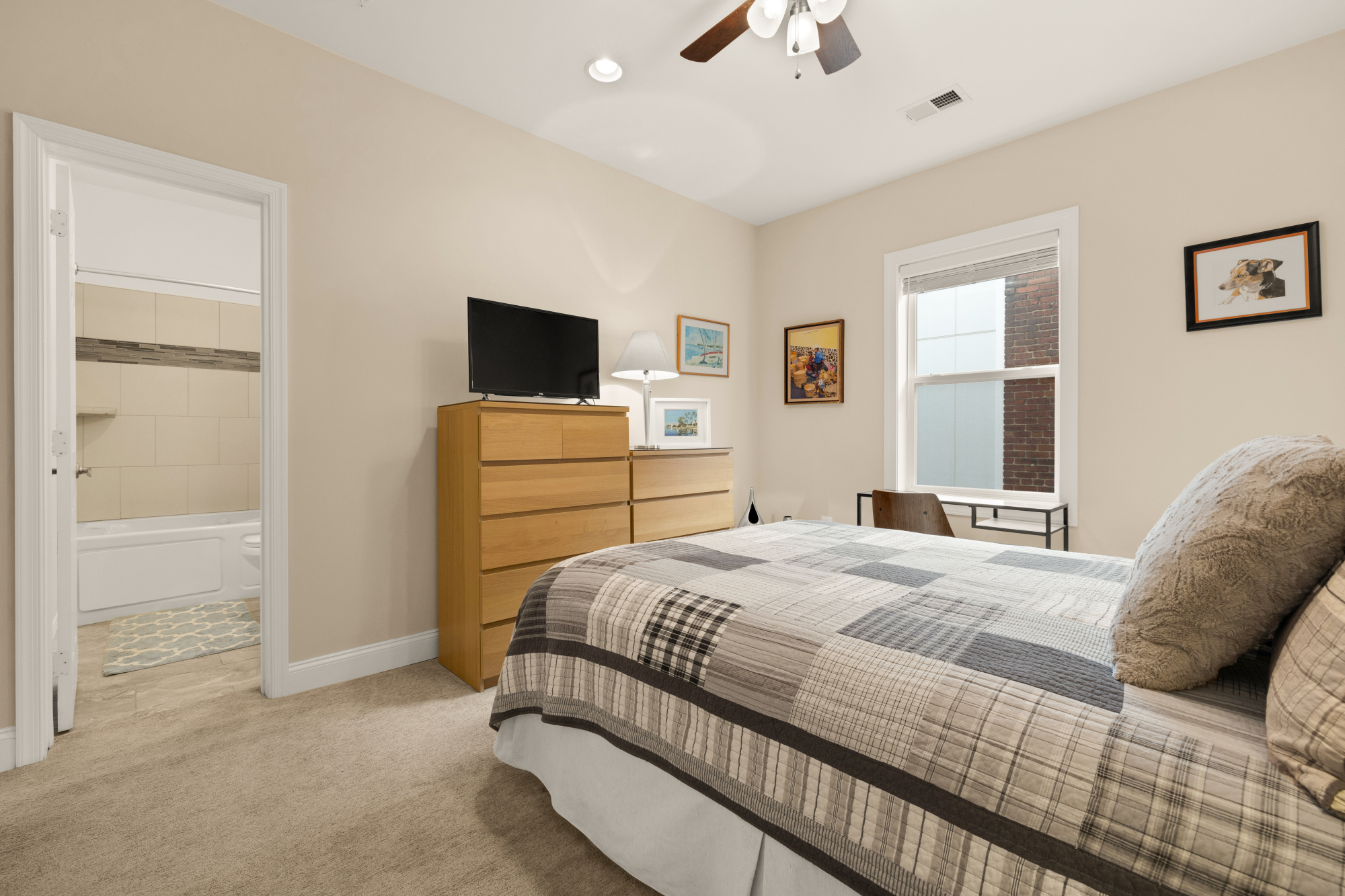 233 S Street Northeast, Unit 4 Washington, DC 20002 - Photo 20 of 37 a bedroom with a bed and a flat screen tv