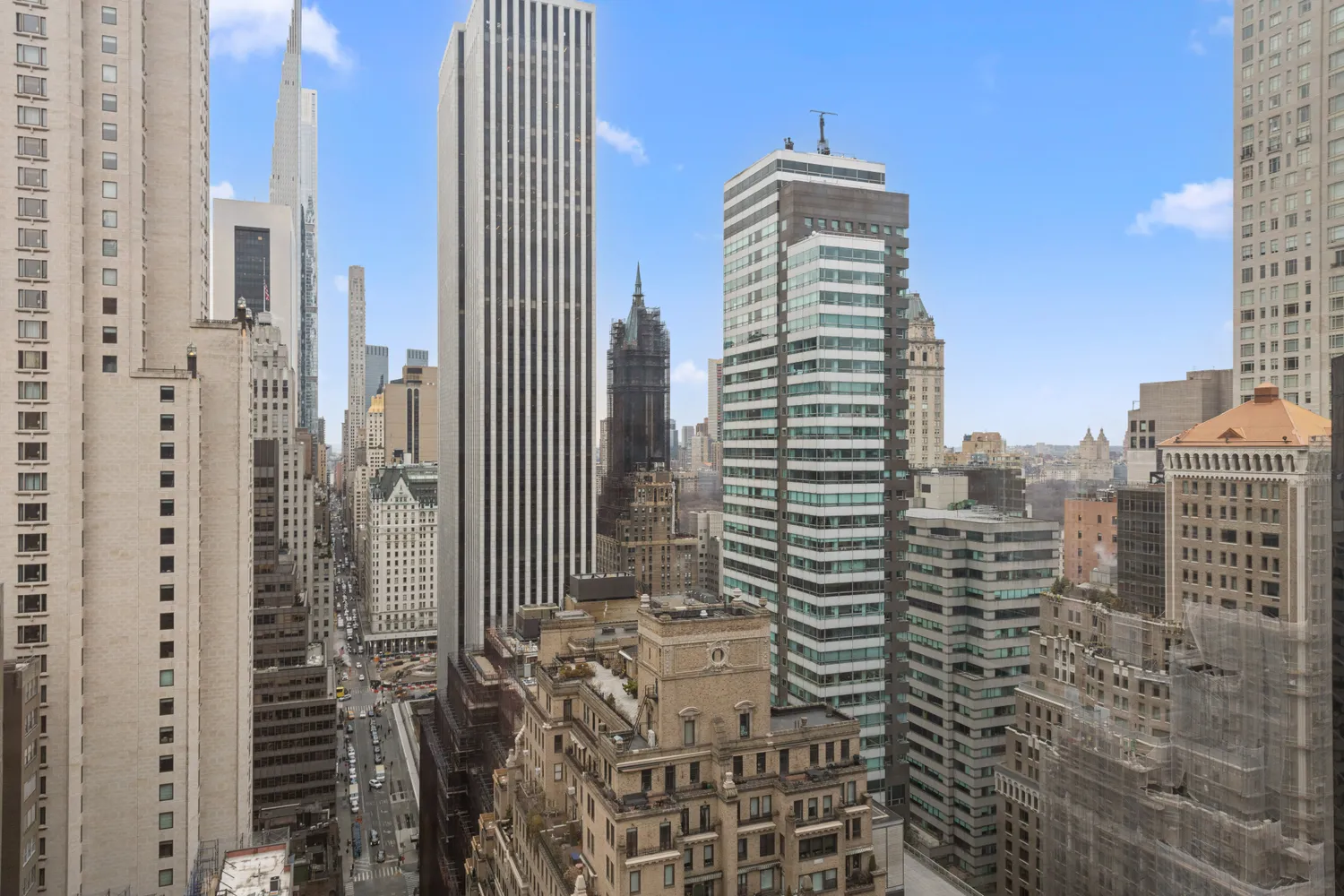 a view of balcony with outdoor seating and city view