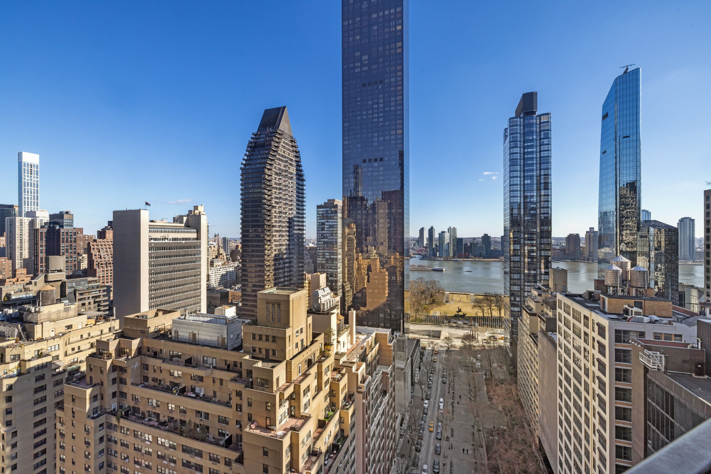 240 East 47th Street, Unit 27C Manhattan, NY 10017 - Photo 1 of 11 a view of a city with tall buildings