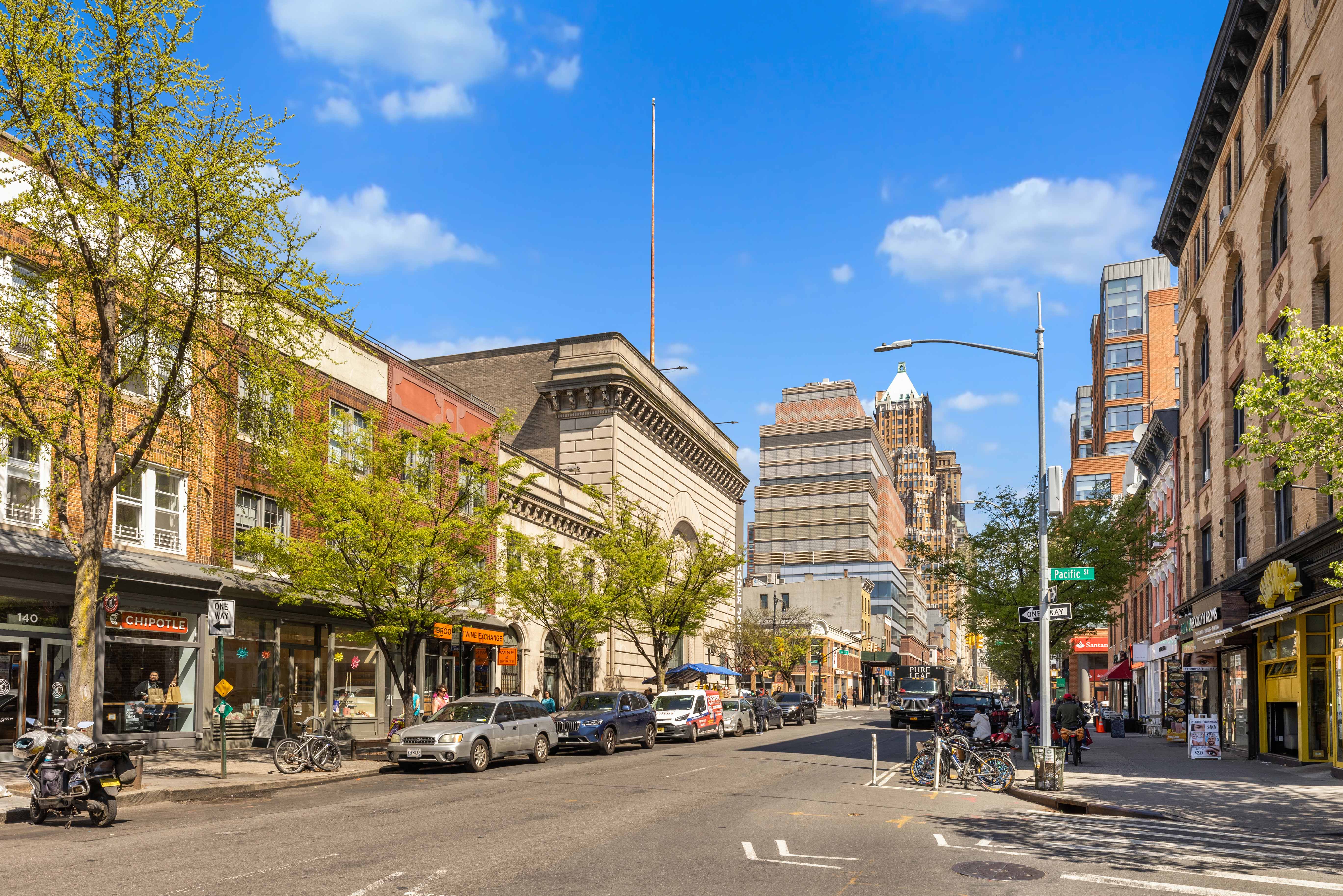 251 Pacific Street, Unit 8 Brooklyn, NY 11201 - Photo 8 of 9 a city street lined with buildings and cars