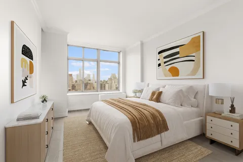 a bedroom with a bed and a painting on the wall