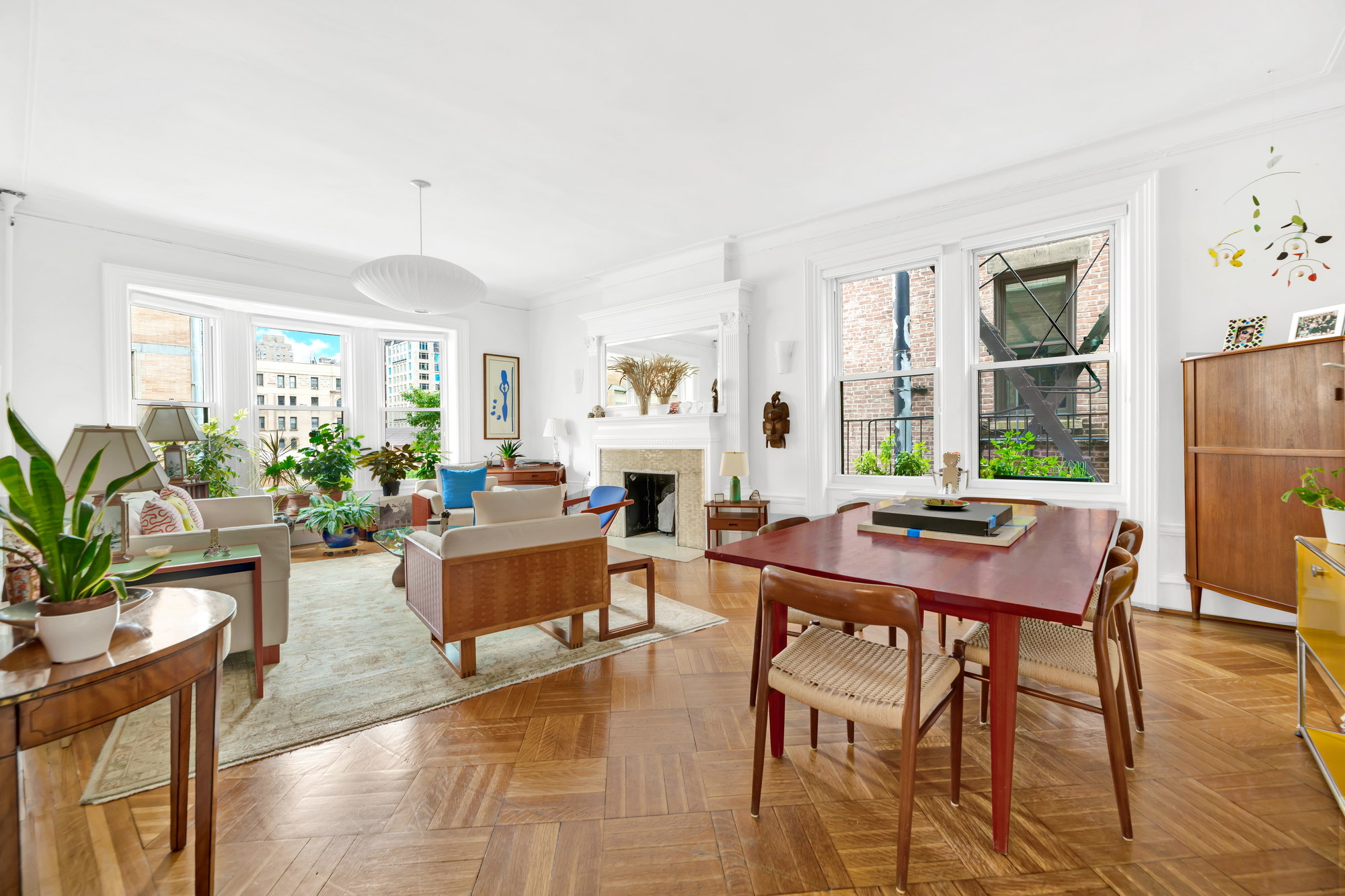 254 West 82nd Street, Unit 5A Manhattan, NY 10024 - Photo 1 of 18 a living room with furniture dining table a window and appliances