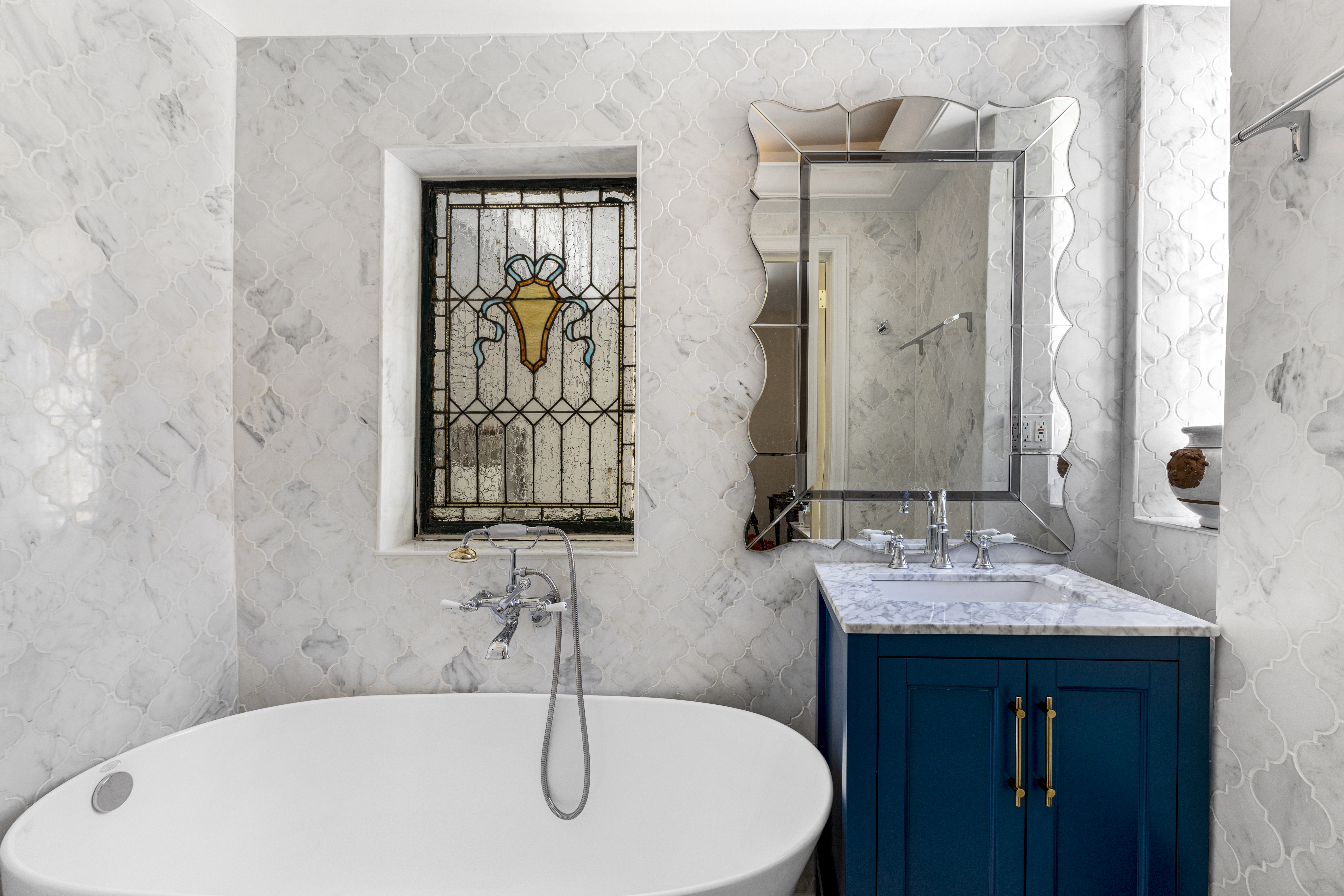 71 East 77th Street, Unit 9C Manhattan, NY 10075 - Photo 8 of 14 a bathroom with a sink and a mirror