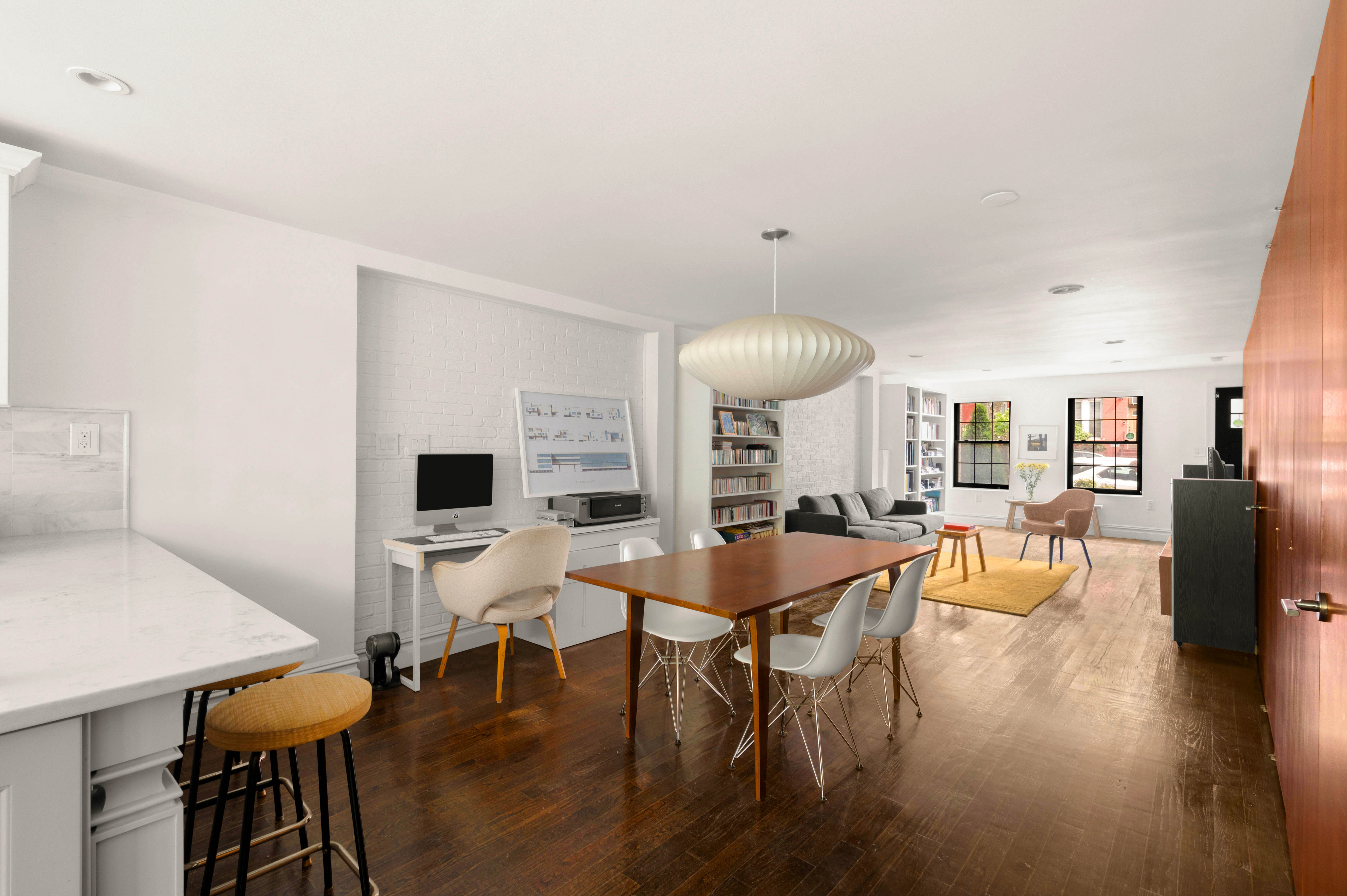 748 Madison Street, Unit 1 Brooklyn, NY 11221 - Photo 1 of 10 a view of a dining room with furniture and wooden floor