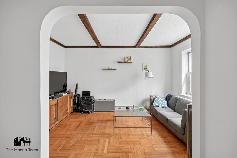 495 Lorimer Street Brooklyn, NY 11211 - Photo 14 of 24 a living room with furniture and a flat screen tv