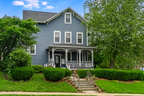 a view of house with yard and garden