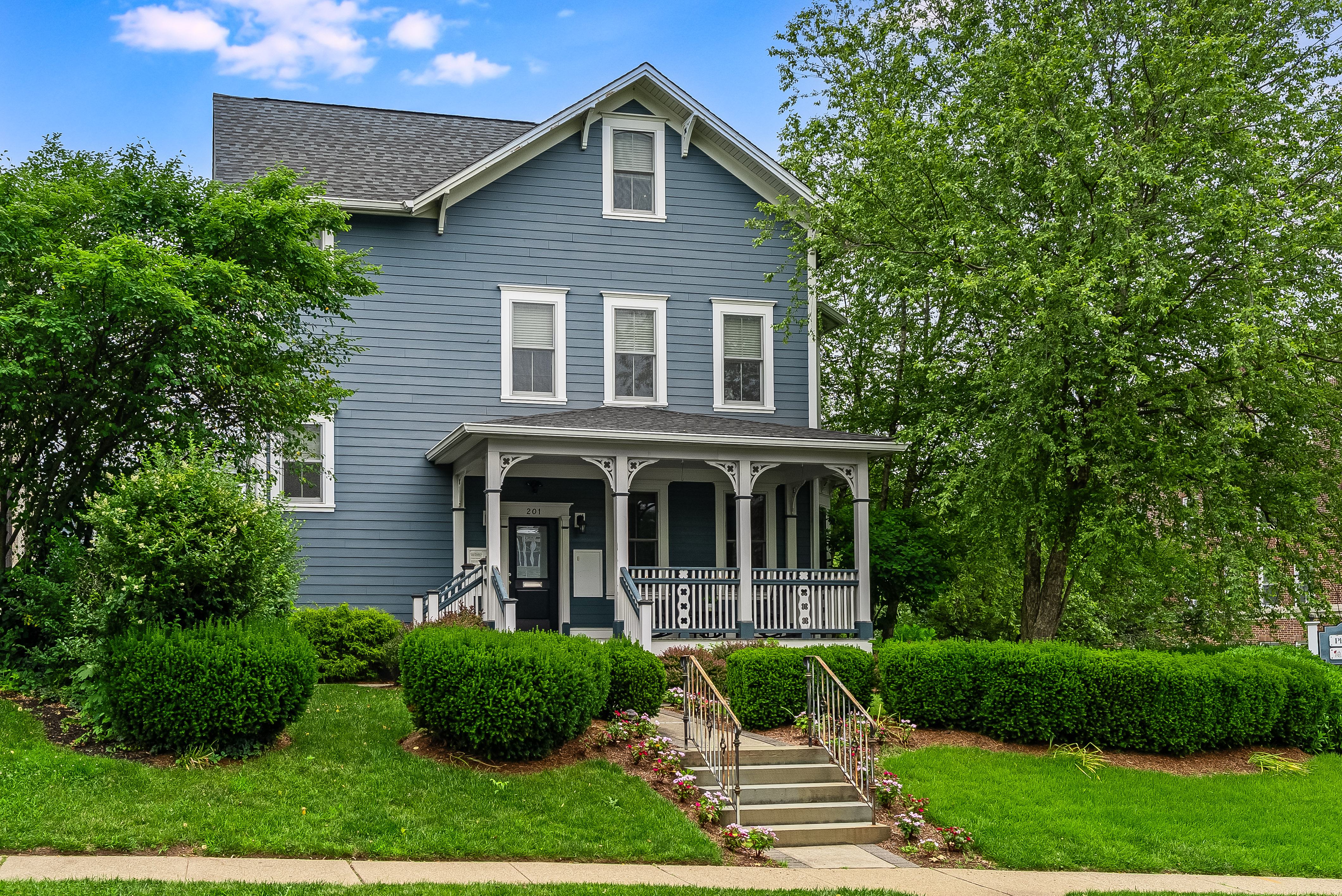 a view of house with yard and garden